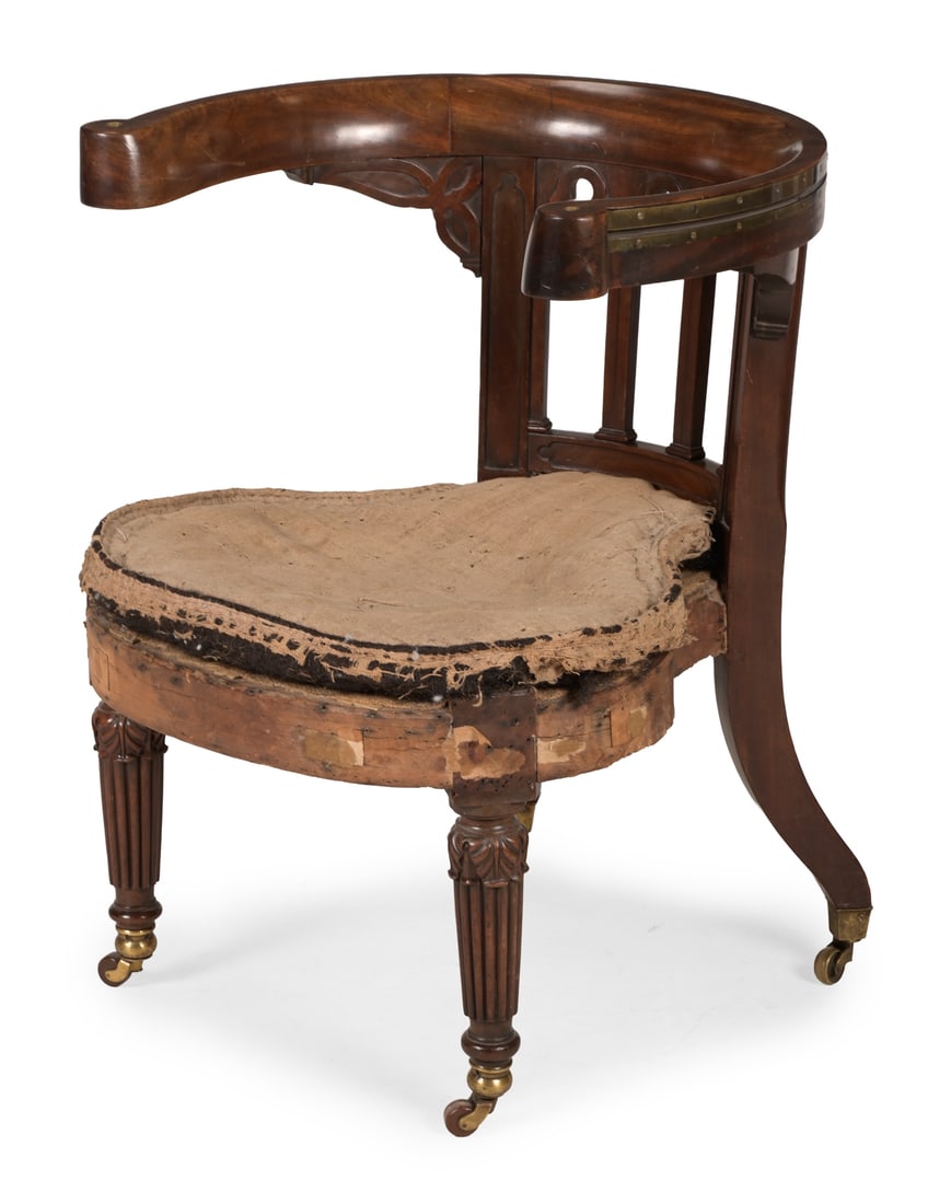 A GEORGE IV MAHOGANY GOTHIC LIBRARY READING CHAIR, IN THE MANNER OF MORGAN & SANDERS, CIRCA 1825 (1 of 3)