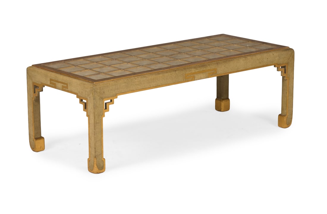 A PAINTED AND PARCEL GILT LOW COFFEE TABLE, IN THE MANNER OF MALLETT ANTIQUES, 20TH CENTURY: A PAINTED AND PARCEL GILT LOW COFFEE TABLEIN THE MANNER OF MALLETT ANTIQUES, 20TH CENTURYPainted to simulate shagreen, with simulated mother of pearl inset panels beneath a glass top43cm high, 120cm w