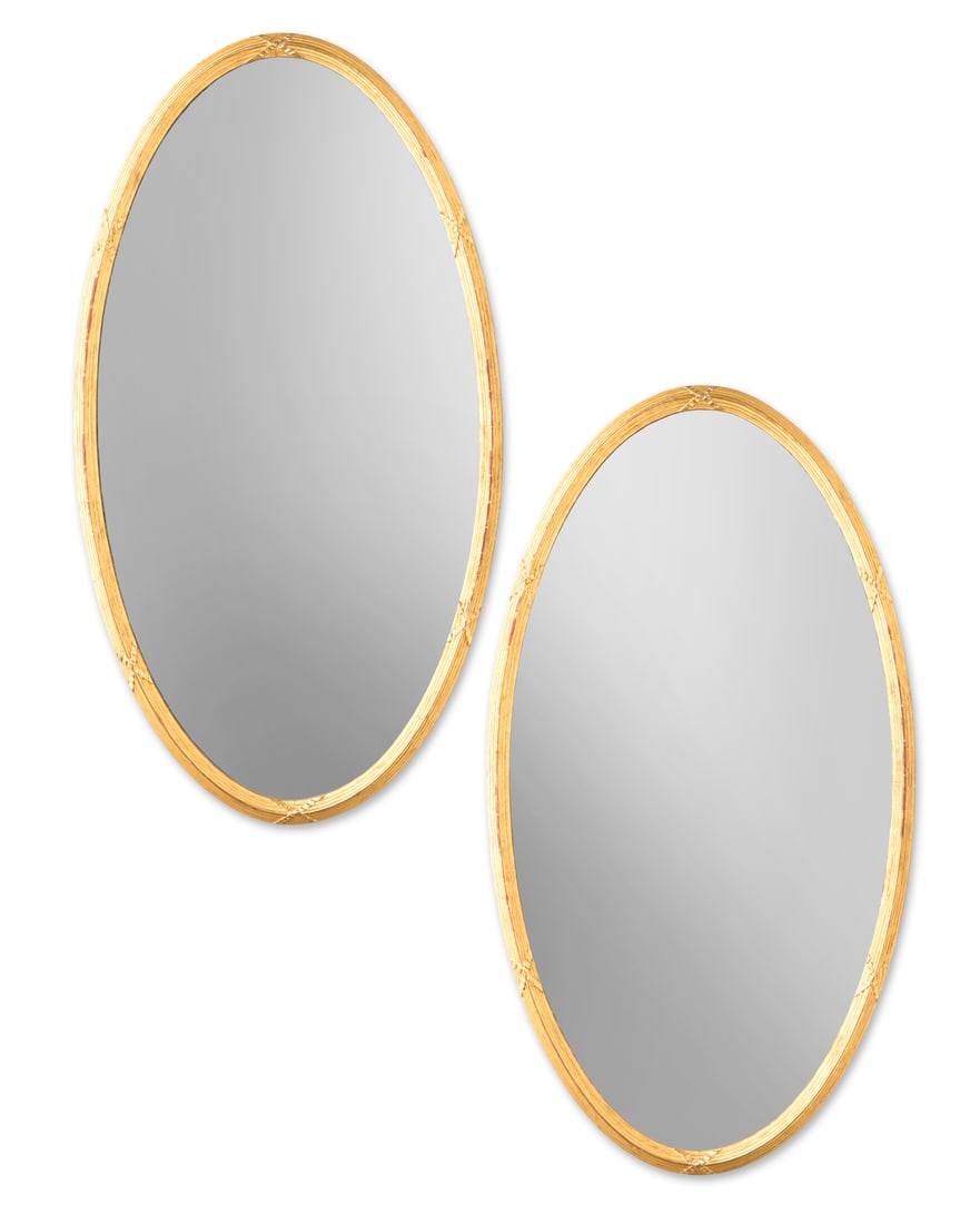 A LARGE PAIR OF VICTORIAN GILTWOOD OVAL MIRRORS, CIRCA 1870: A LARGE PAIR OF VICTORIAN GILTWOOD OVAL MIRRORSCIRCA 1870160cm high, 90.5cm wideProvenance:Corby Castle, Cumbria
