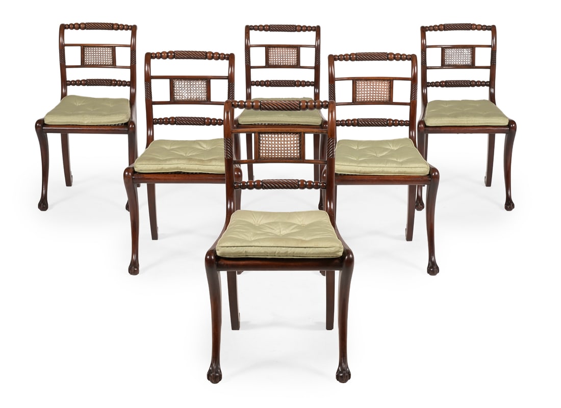 A SET OF SIX REGENCY MAHOGANY DINING CHAIRS, IN THE MANNER OF GILLOWS, CIRCA 1815: A SET OF SIX REGENCY MAHOGANY DINING CHAIRSIN THE MANNER OF GILLOWS, CIRCA 1815With unusual carved claw and ball terminals to the front sabre legs84cm high, 47cm wide, 53cm deep