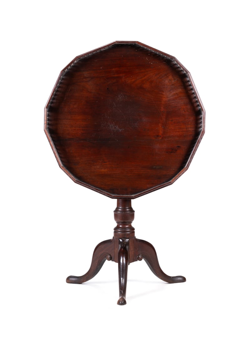 AN UNUSUAL GEORGE III MAHOGANY 'BIRDCAGE' TRIPOD TABLE, CIRCA 1760: AN UNUSUAL GEORGE III MAHOGANY 'BIRDCAGE' TRIPOD TABLE CIRCA 1760The hexadecagonal tilt top with a gothic fret gallery 76cm high, 71cm diameter