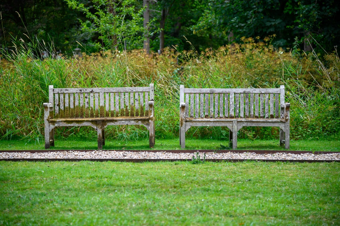 A PAIR OF HARDWOOD GARDEN BENCHES, 20TH CENTURY (1 of 2)