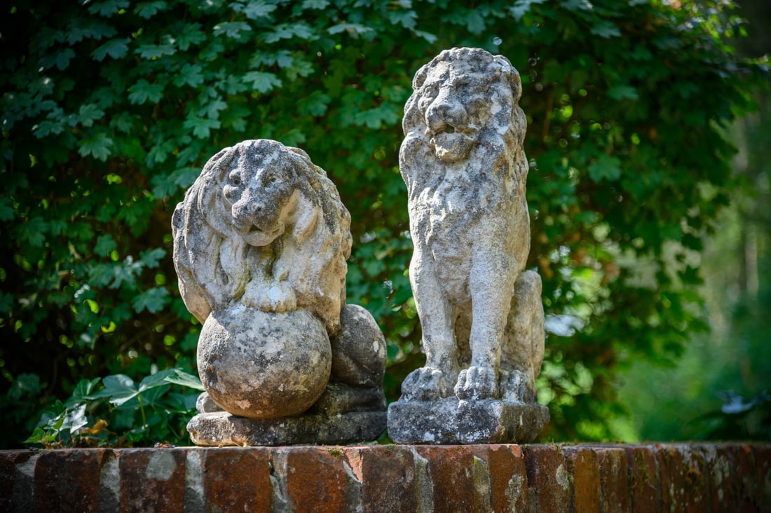 A PAIR OF CARVED STONE MODELS OF A LION AND LIONESS, 20TH CENTURY (1 of 4)