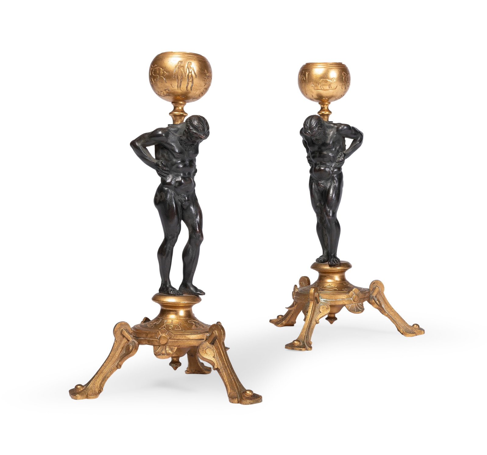 A PAIR OF FRENCH GILT AND PATINATED BRONZE ATLAS CANDLESTICKS, LATE 19TH CENTURY: A PAIR OF FRENCH GILT AND PATINATED BRONZE ATLAS CANDLESTICKS LATE 19TH CENTURY 19.5cm high Provenance: Wooley & Wallis, Furniture, W