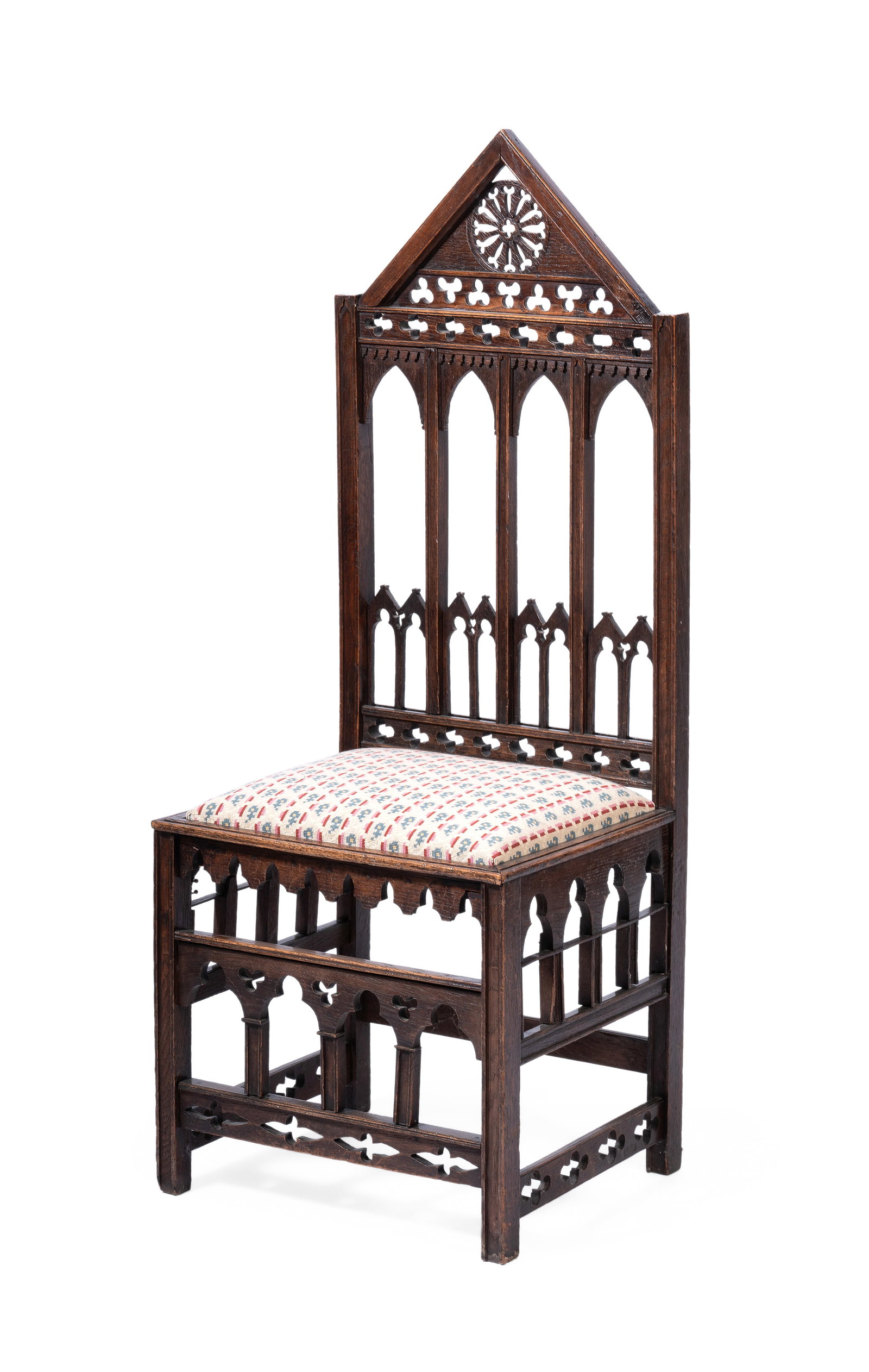 AN OAK GOTHIC REVIVAL SIDE CHAIR, LATE 19TH CENTURY: AN OAK GOTHIC REVIVAL SIDE CHAIR LATE 19TH CENTURY The seat upholstered in Colefax & Fowler ‘Bordeaux’ fabric 119cm high, 46cm wide, 40cm deep Condition Report Disclaimer