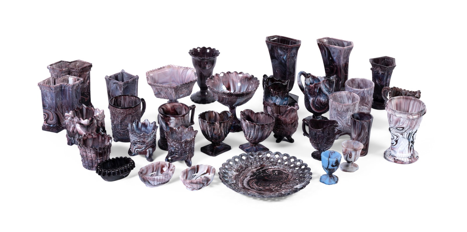 A COLLECTION OF ENGLISH PRESS MOULDED 'PURPLE MALACHITE' GLASS ITEMS, CIRCA 1880: A COLLECTION OF ENGLISH PRESS MOULDED 'PURPLE MALACHITE' GLASS ITEMS CIRCA 1880 Including, jugs, vases, bowls, etc. 17.5cm high and smaller Condition Report Disclaimer