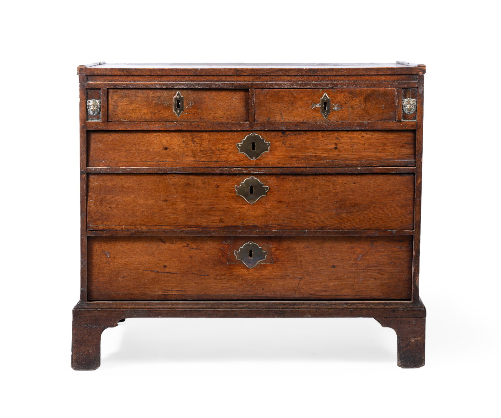 AN OAK CHEST, ENGLISH, EARLY 18TH CENTURY AND LATER: AN OAK CHEST ENGLISH, EARLY 18TH CENTURY AND LATER With two short and three long drawers 84cm high, 98cm wide, 59cm deep