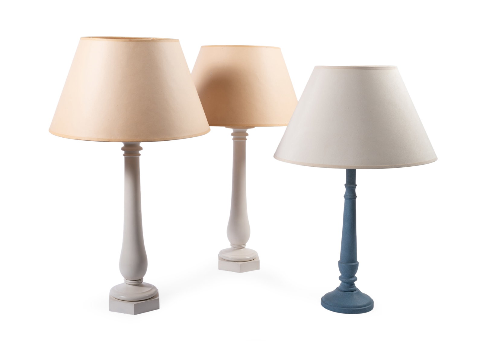A PAIR OF PAINTED WOOD TABLE LAMPS, BY GEORGE OAKES, LATE 20TH CENTURY, TOGETHER WITH A BLUE EXAMPLE: A PAIR OF CREAM PAINTED WOOD TABLE LAMPS BY GEORGE OAKES, LATE 20TH CENTURY Fitted for electricity, with card shades 70cm high overall Sold together with the original technical drawing by George