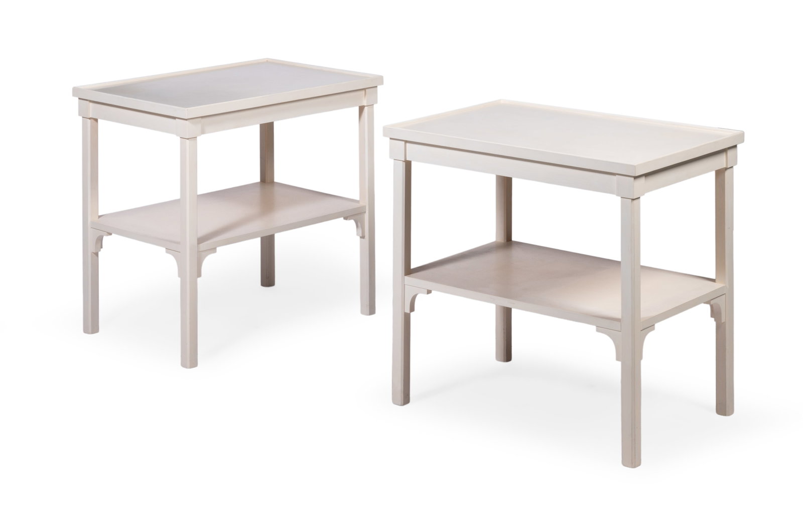 A PAIR OF PAINTED TWO TIER TABLES, BY GEORGE OAKES FOR SIBYL COLEFAX & JOHN FOWLER, 20TH CENTURY: A PAIR OF WHITE PAINTED TWO TIER TABLES BY GEORGE OAKES FOR SIBYL COLEFAX & JOHN FOWLER, LATE 20TH CENTURY 64cm high, 65cm wide, 45cm deep Condition Report Disclaimer
