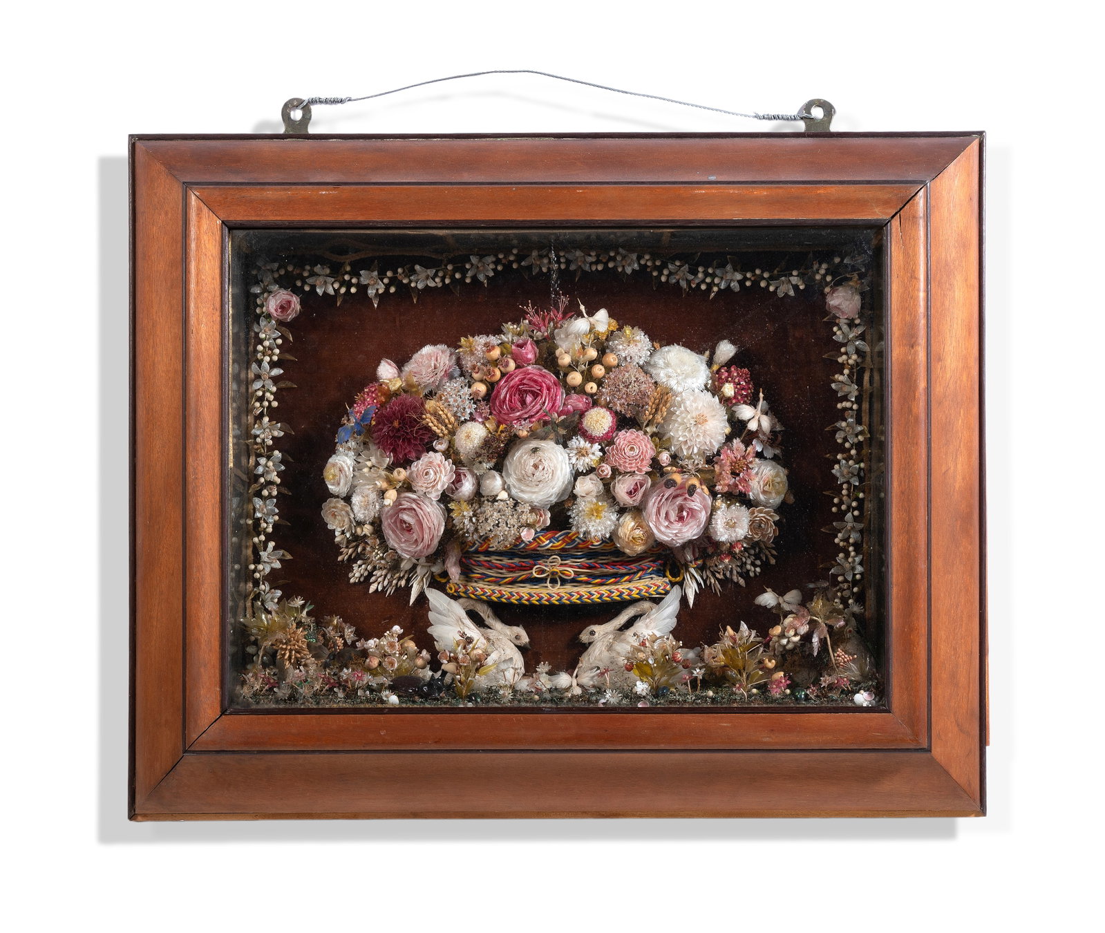 Y A SHELLWORK, MICA AND PAPERWORK DIORAMA, CIRCA 1870 AND LATER: Y A SHELLWORK, MICA AND PAPERWORK DIORAMA CIRCA 1870 AND LATER With central basket of flowers within a garland border, and set above a pair of model swans with featherwork wings Set within
