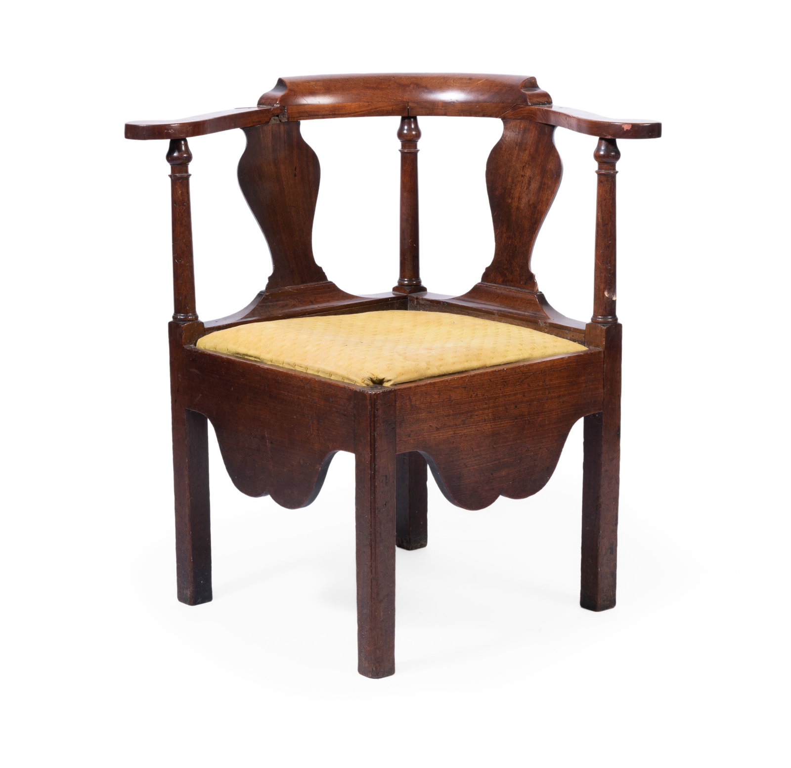 AN EARLY GEORGE III MAHOGANY CORNER ARMCHAIR, MID 18TH CENTURY: AN EARLY GEORGE III MAHOGANY CORNER ARMCHAIR MID 18TH CENTURY With yellow cotton drop-in seat 77cm high, 52cm deep Condition Report Disclaimer