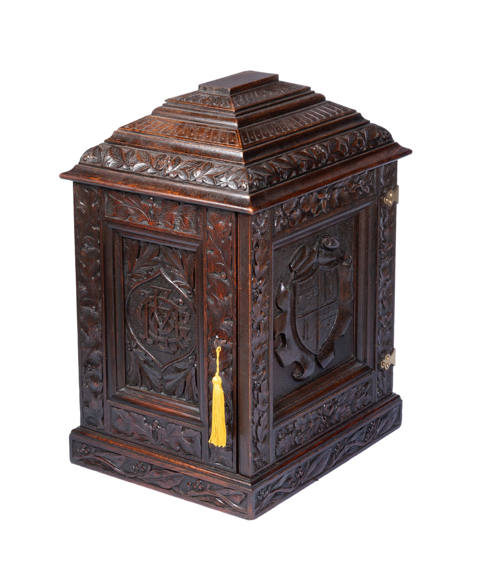 A VICTORIAN CARVED OAK TABLE CABINET, 19TH CENTURY: A VICTORIAN CARVED OAK TABLE CABINET 19TH CENTURY Of tabletop form, the interior fitted with four drawers 61cm high, 44cm wide, 36cm deep Provenance: Lyon & Turnbull, Five Centuries, 18 May 2022,