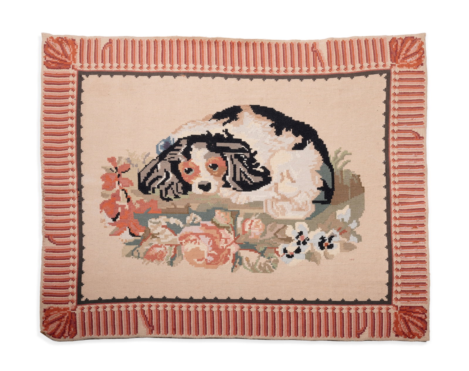 A CROSS-STITCH, NEEDLEWORK RUG DEPICTING A SPANIEL, FOR SIBYL COLEFAX & JOHN FOWLER, 20TH CENTURY: A CROSS-STITCH NEEDLEWORK RUG DEPICTING A CAVALIER KING CHARLES SPANIEL HAND WOVEN IN PORTUGAL FOR SIBYL COLEFAX & JOHN FOWLER, LATE 20TH CENTURY Labelled to reverse approximately 120 x 155cm A