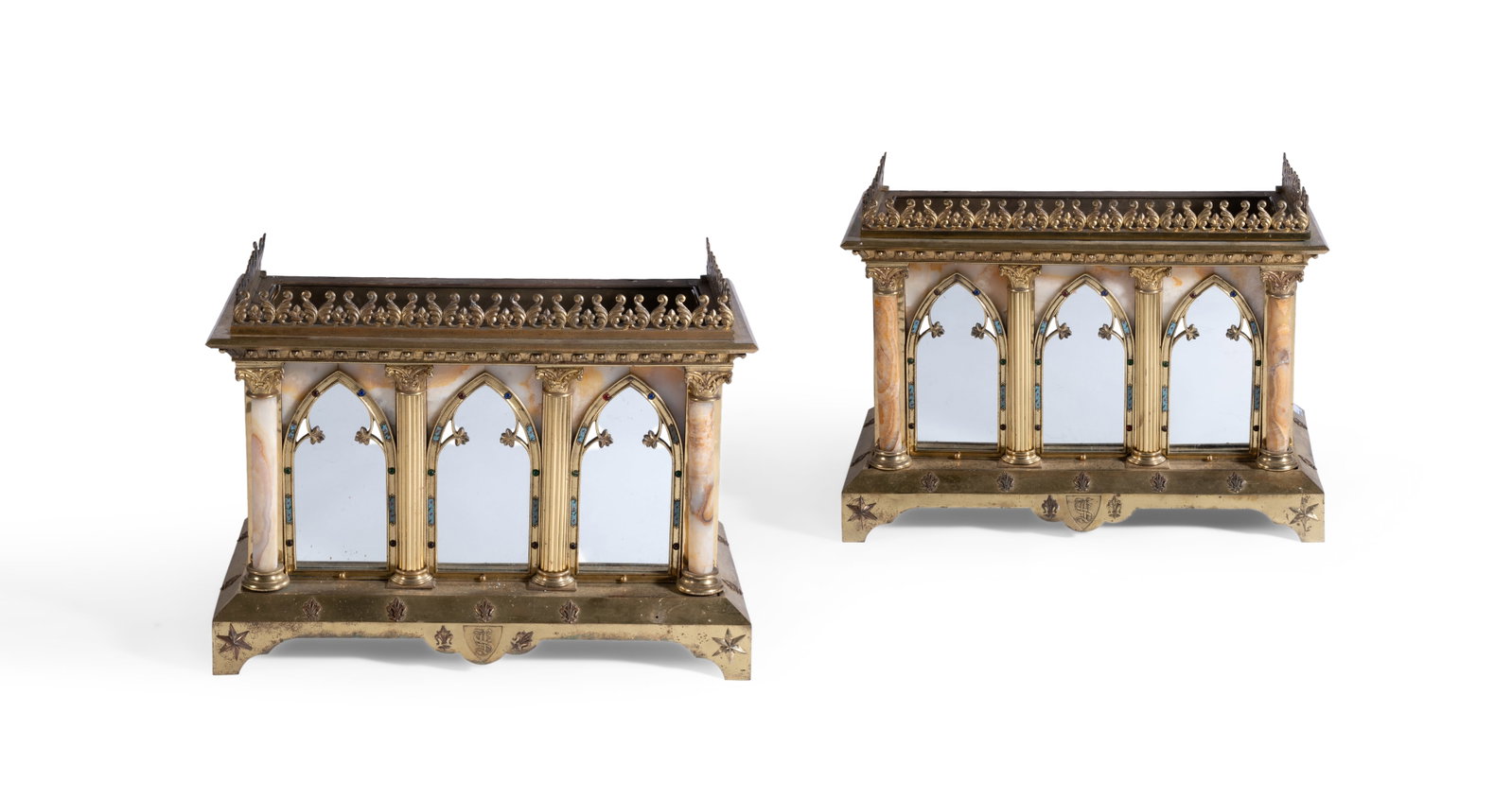 A PAIR OF GILT BRONZE AND CHAMPLEVE MOUNTED ONYX JARDINIERES, FRENCH, SECOND HALF 19TH CENTURY: A PAIR OF GILT BRONZE AND CHAMPLEVE MOUNTED ONYX JARDINIERES FRENCH, IN THE GOTHIC TASTE, SECOND HALF 19TH CENTURY Of architectural form each 57cm high, 80cm wide, 4