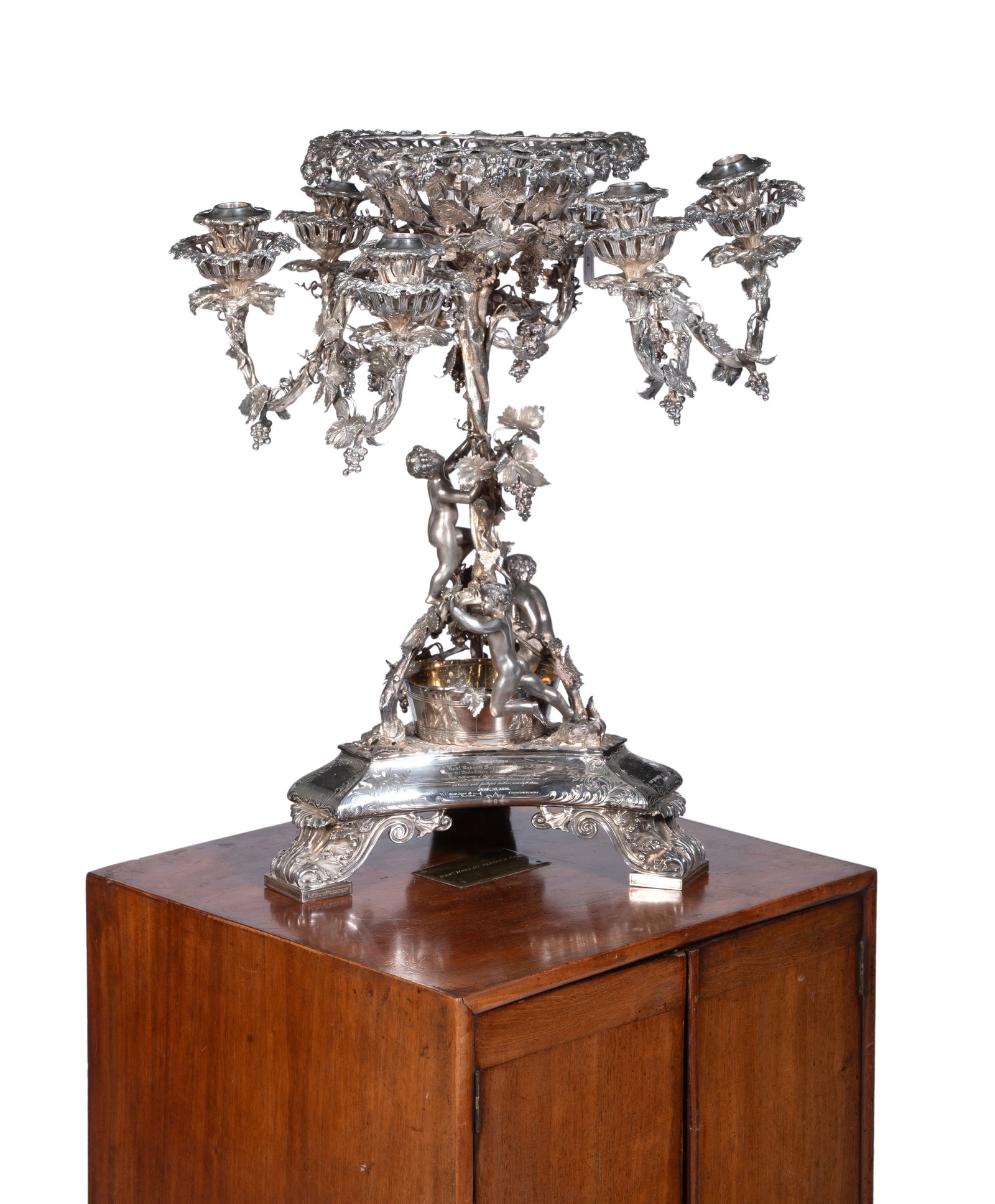 A CASED VICTORIAN ELECTROPLATED CANDELABRUM OR EPERGNE, CIRCA 1855: A CASED VICTORIAN ELECTROPLATED CANDELABRUM OR EPERGNE BY GEORGE RICHMOND COLLIS & CO., BIRMINGHAM, CIRCA 1855 With a central circular basket, three scroll arms with two capitals each, the stem