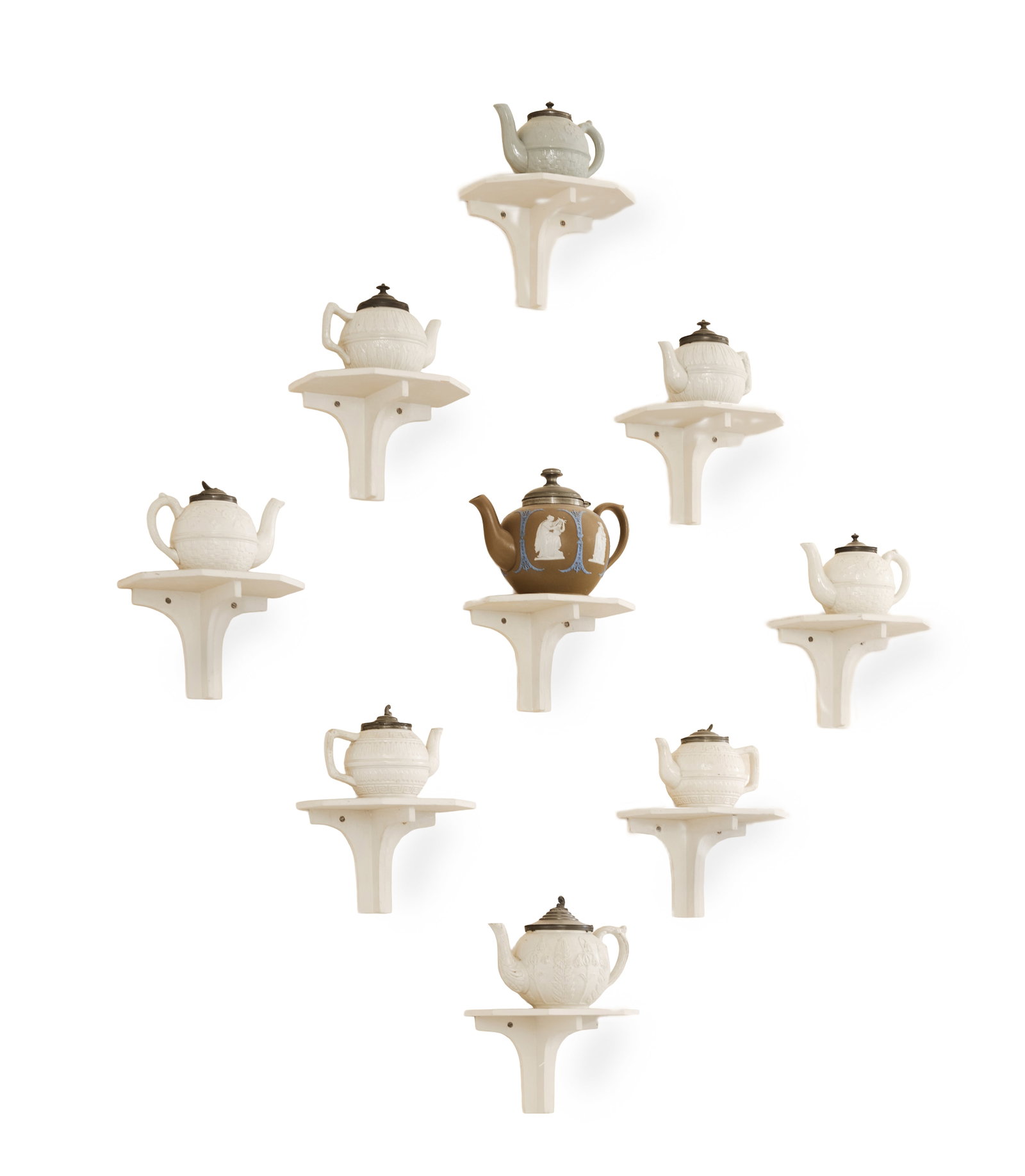 A COLLECTION OF MOSTLY STAFFORDSHIRE DRY-BODIED STONEWARE TEAPOTS AND COVERS, WITH WALL BRACKETS: A COLLECTION OF MOSTLY STAFFORDSHIRE DRY-BODIED STONEWARE TEAPOTS AND COVERS VARIOUS DATES 19TH CENTURY Some glazed 13cm high and smaller Together with wall brackets designed and painted by