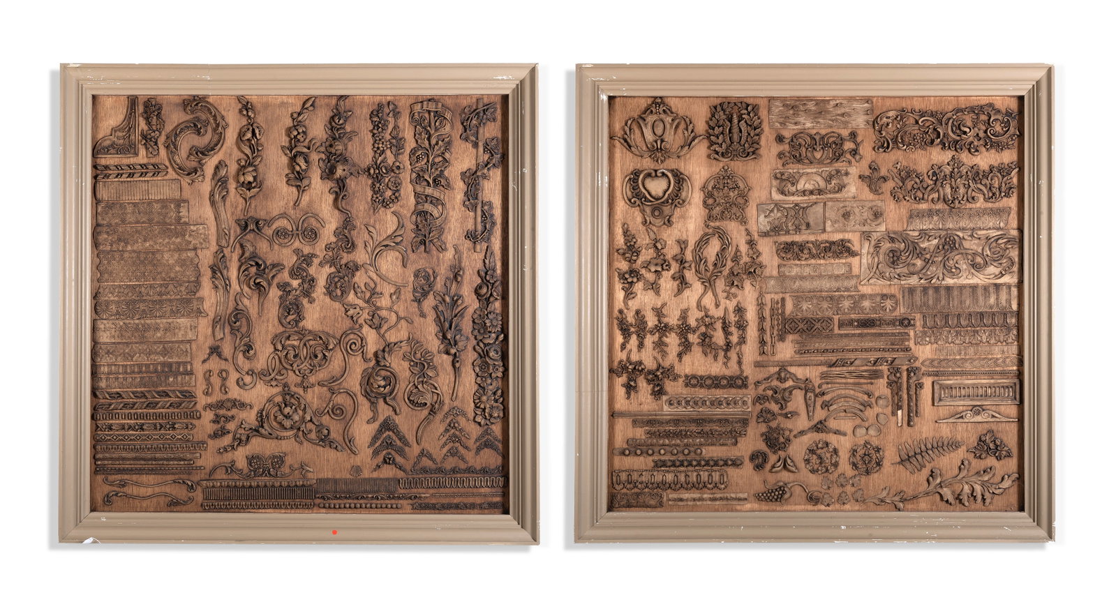 A PAIR OF FRAMED PANELS OF PLASTER SAMPLE MOULDINGS, ELEMENTS PROBABLY 19TH CENTURY AND LATER: A PAIR OF FRAMED PANELS OF PLASTER SAMPLE MOULDINGS ELEMENTS PROBABLY 19TH CENTURY AND LATER Each panel mounted with ornamental motifs including floral and foliage ornament, scrolls, and borders