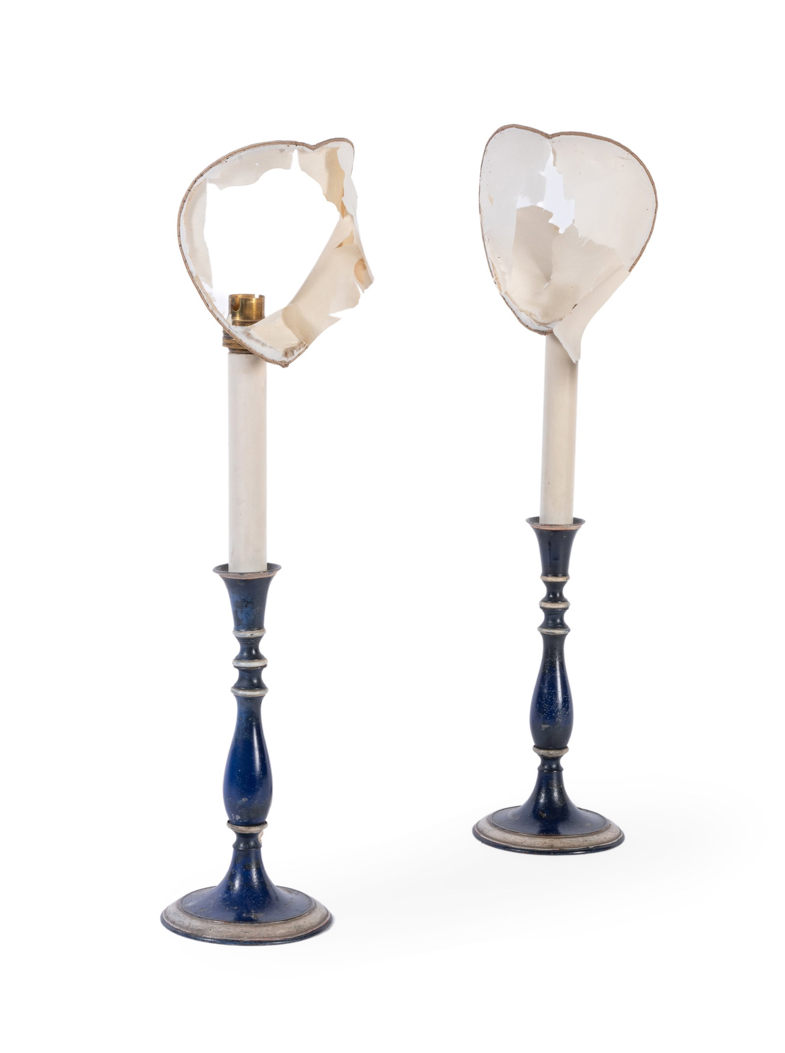 A PAIR OF BLUE PAINTED TOLE CANDLESTICK TABLE LAMPS, PROBABLY FRENCH, SECOND HALF 19TH CENTURY: A PAIR OF BLUE PAINTED TOLE CANDLESTICK TABLE LAMPS PROBABLY FRENCH, SECOND HALF 19TH CENTURY Probably later repainted by John Fowler, fitted for electricity, with clip on fabric shades, with a