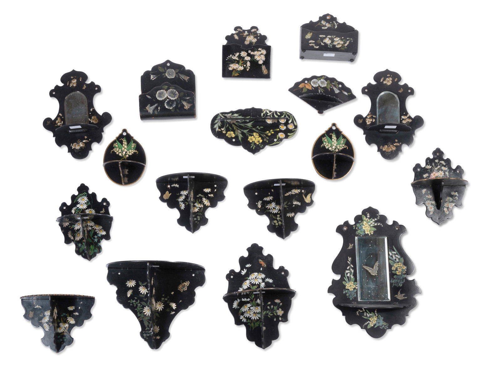 A COLLECTION OF VICTORIAN BLACK LACQUER PAPIER MACHE WALL BRACKETS, SECOND HALF 19TH CENTURY: A COLLECTION OF SEVENTEEN VICTORIAN FLORAL PAINTED BLACK LACQUER PAPIER MACHE WALL BRACKETS SECOND HALF 19TH CENTURY Some containing mirrors The largest 47cm high Condition Report Disclaimer
