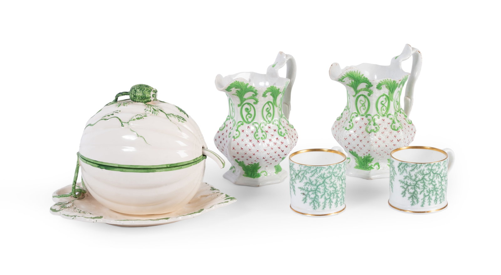 A PAIR OF STAFFORDSHIRE PEARLWARE JUGS, CIRCA 1840, TOGETHER WITH THREE FURTHER ITEMS: A PAIR OF STAFFORDSHIRE PEARLWARE OCTAGONAL SECTION JUGS CIRCA 1840 Moulded in relief with a diaper ground enriched in puce and green scrolling foliage 19cm high <