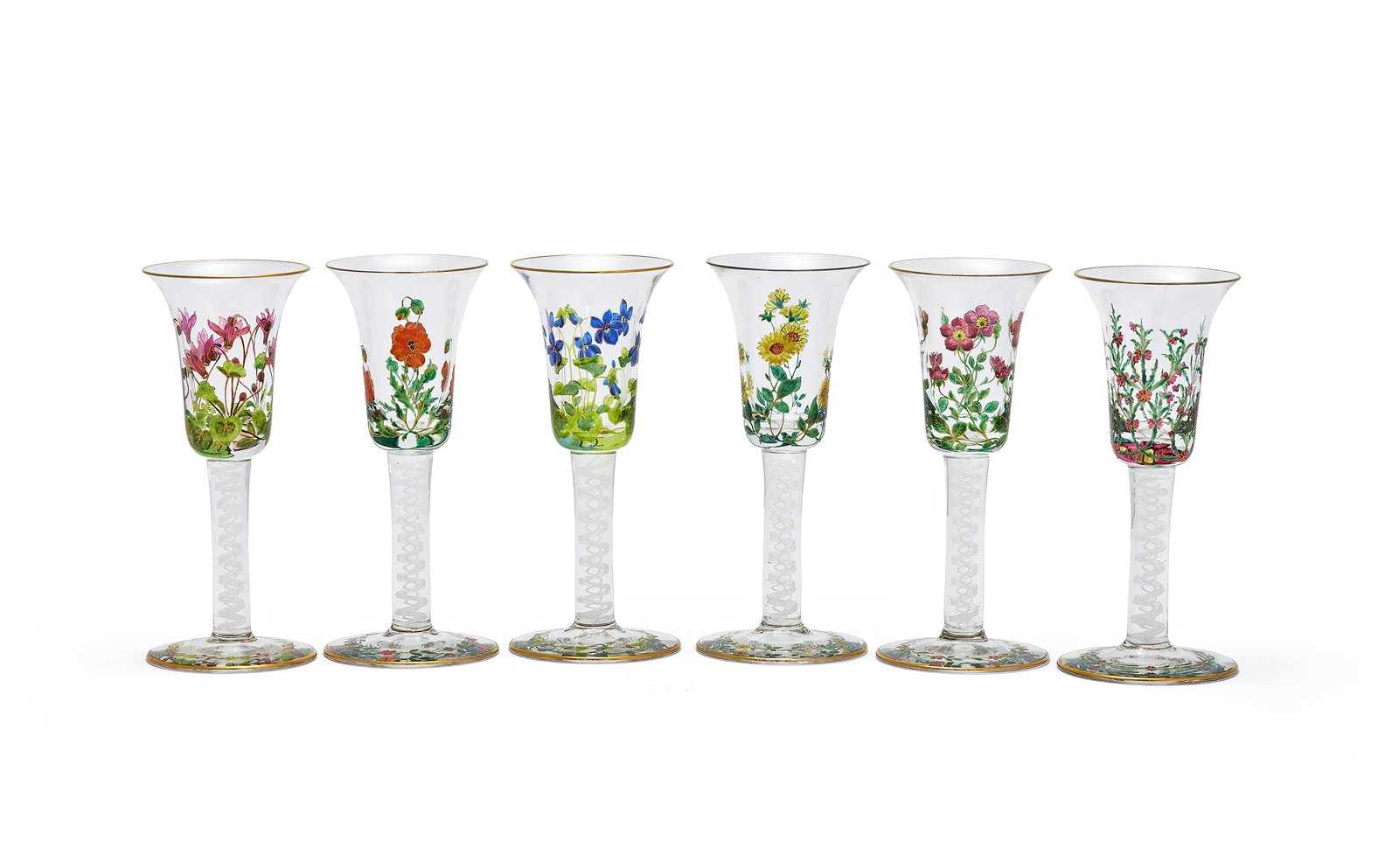 A SET OF SIX ENAMELLED AND OPAQUE TWIST WINE GLASSES, 20TH CENTURY: A SET OF SIX ENAMELLED AND OPAQUE TWIST WINE GLASSES20TH CENTURYThe bell bowls decorated in mid 18th century English style with coloured flower-sprays, on double-series stems and conical feet, gilt-li