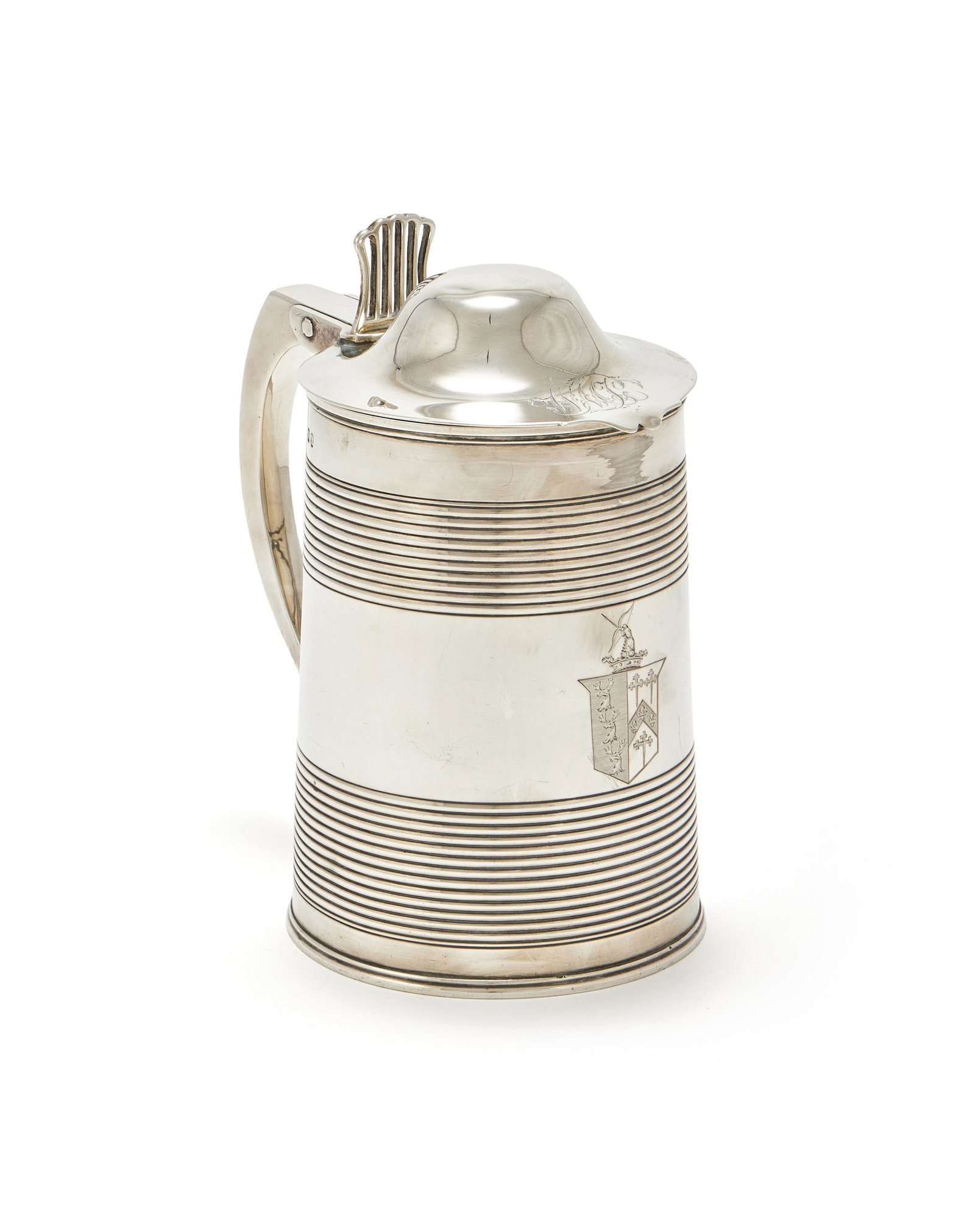 A GEORGE III SILVER TANKARD, PETER & WILLIAM BATEMAN, LONDON 1807: A GEORGE III SILVER TANKARDPETER & WILLIAM BATEMAN, LONDON 1807The domed cover engraved WMJ, the reeded body with a scroll handle and engraved with an armorial19cm high867g (27.9 oz)These are impaled 