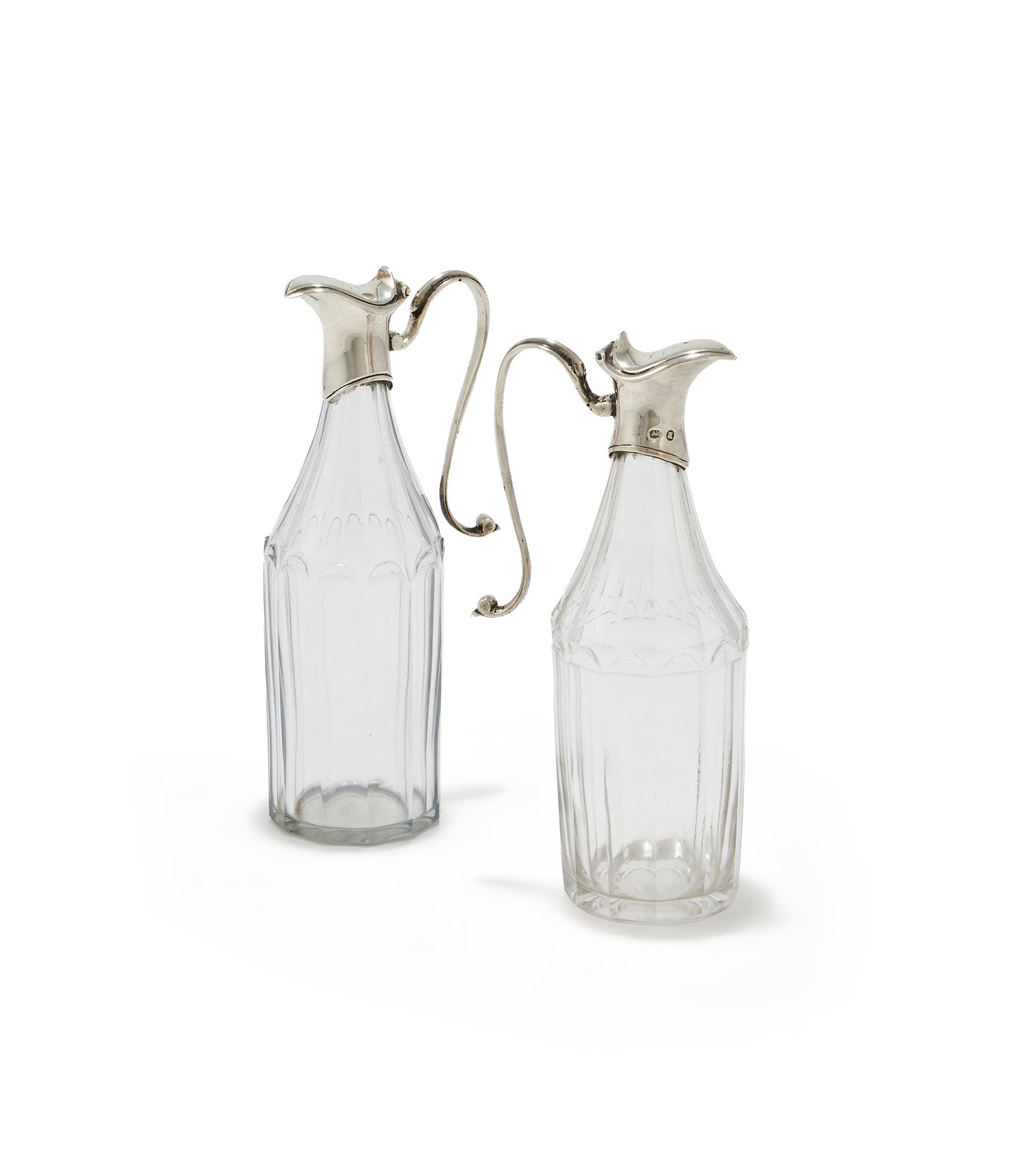A PAIR OF SILVER MOUNTED AND FACETTED GLASS OIL BOTTLES, ROBERT HENNELL, CIRCA 1790 (1 of 2)