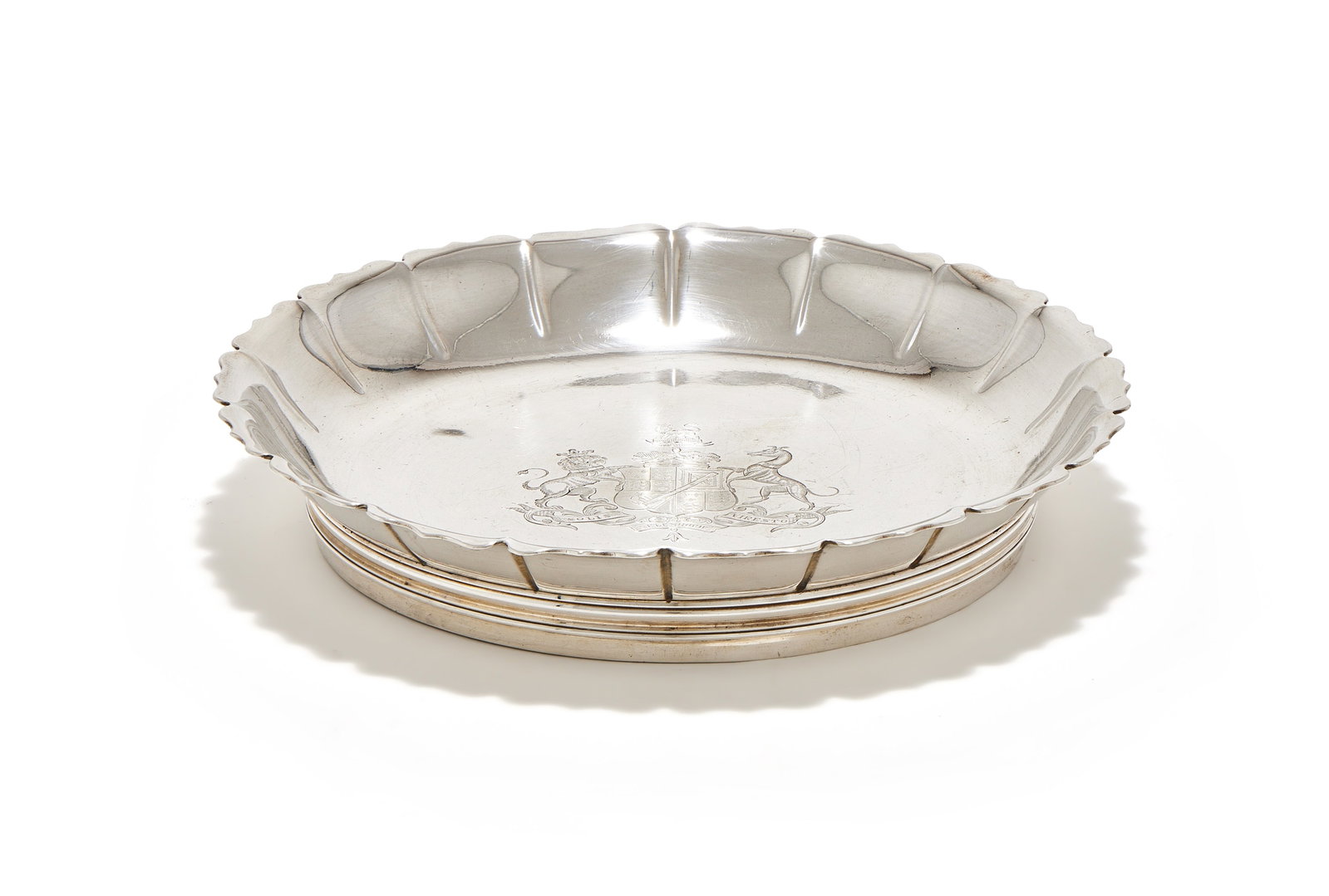 A GEORGE II SILVER STRAWBERRY OR EPERGNE DISH, EDWARD VINCENT, LONDON 1734: A GEORGE II SILVER STRAWBERRY OR EPERGNE DISHEDWARD VINCENT, LONDON 1734With a shaped border, engraved with an armorial and on a circular foot25cm diameter880g (28.3 oz)Provenance:Sale, Christie's Lon