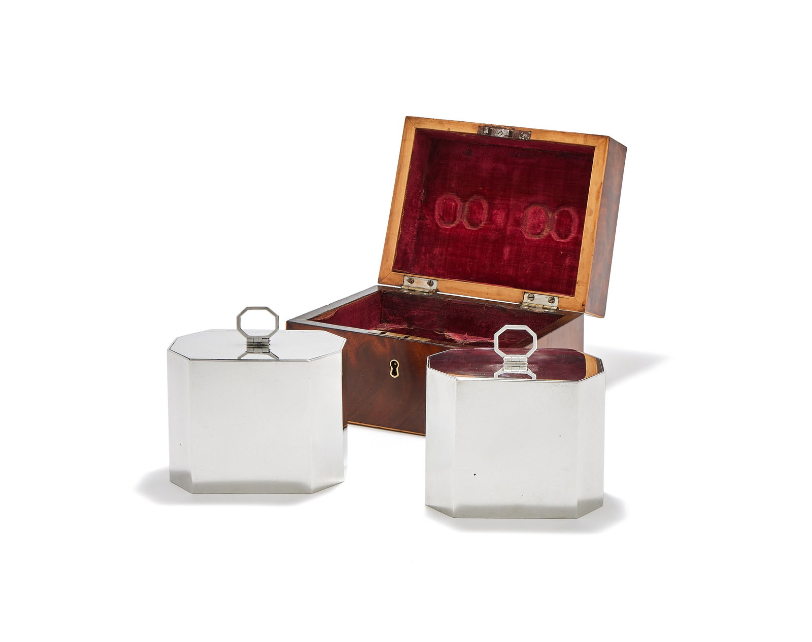 A CASED PAIR OF GEORGE III SILVER OCTAGONAL TEA CADDIES, WILLIAM VINCENT, LONDON 1787: A CASED PAIR OF GEORGE III SILVER OCTAGONAL TEA CADDIESWILLIAM VINCENT, LONDON 1787With swing loop handles to the flat covers13cm long884g (28.4 oz)