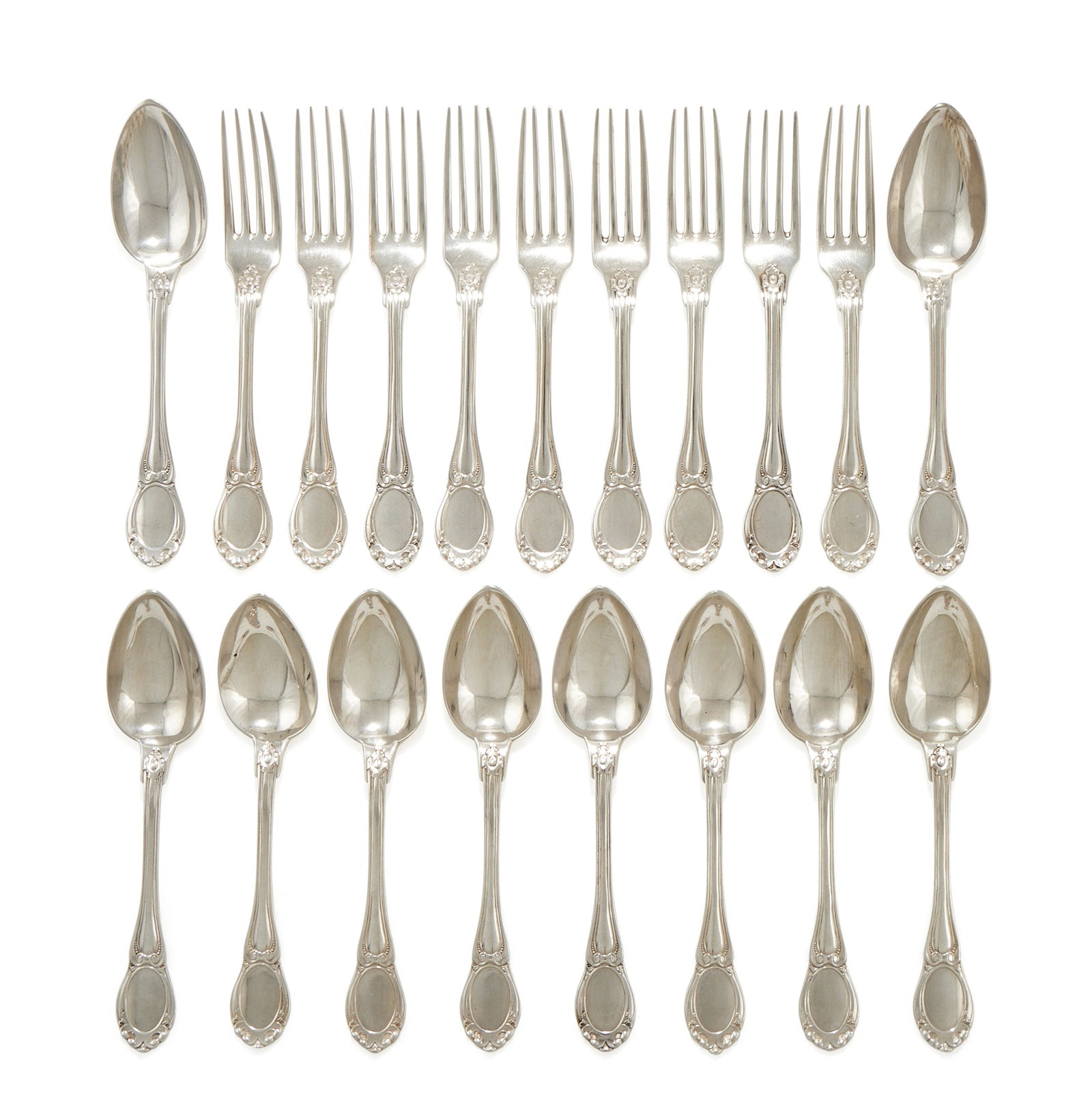 A SET OF NINE FRENCH SILVER TABLE FORKS AND TEN TABLE SPOONS, HIPPOLYTE THOMAS, PARIS CIRCA 1850: A SET OF NINE FRENCH SILVER TABLE FORKS AND TEN TABLE SPOONSHIPPOLYTE THOMAS, PARIS CIRCA 1850Engraved with an armorialThe forks 21cm long, the spoons 21cm long1566g (50.35 oz)Provenance:From the Coll