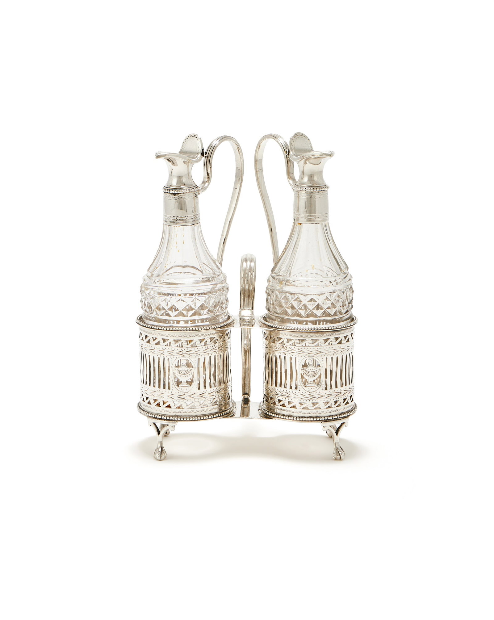 A GEORGE II SILVER OIL AND VINEGAR CRUET STAND, THOMAS DANIELL & JOHN WALL, LONDON 1781: A GEORGE II SILVER OIL AND VINEGAR CRUET STANDTHOMAS DANIELL & JOHN WALL, LONDON 1781With a scroll handle, beaded borders, engraved with a crest, pierced with urns and bands, on four ball and claw fee