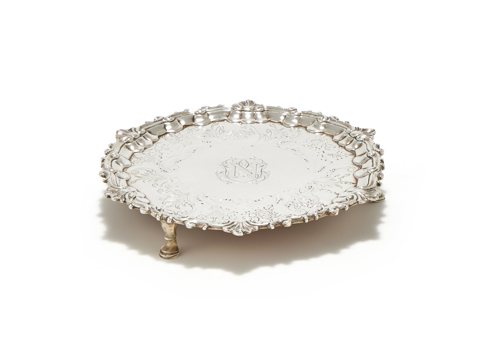 A GEORGE II IRISH SILVER SHAPED CIRCULAR WAITER, ISAAC D'OLIER, DUBLIN, NO DATE LETTER, CIRCA 1750 (1 of 3)