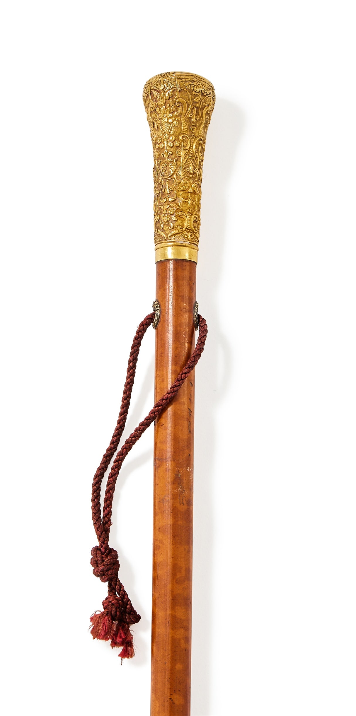 A GOLD MOUNTED WALKING STICK, LATE 18TH CENTURY, UNMARKED: A GOLD MOUNTED WALKING STICKLATE 18TH CENTURY, UNMARKEDThe burl Malacca cane with a gold pommel chased with flowers, foliage and scrolls80.5cm long