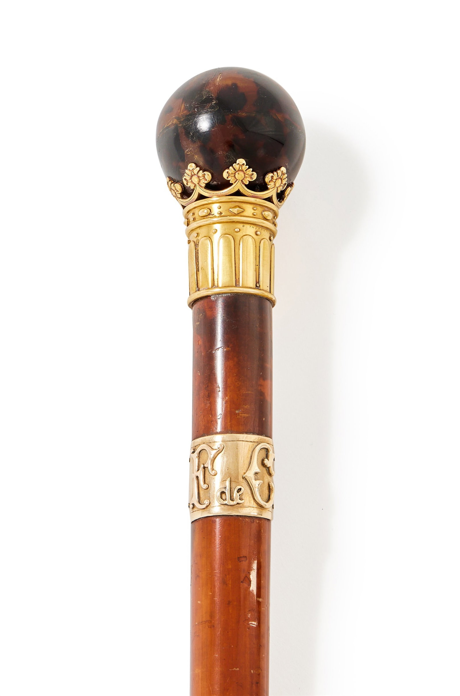 Y A VICTORIAN 18 CARAT GOLD MOUNTED AND TORTOISESHELL WALKING STICK, EDWARD H. STOCKWELL, LONDON: Y A VICTORIAN 18 CARAT GOLD MOUNTED AND TORTOISESHELL WALKING STICKEDWARD H. STOCKWELL, LONDON 1883The Malacca cane with a tortoiseshell ball pommel, seated in a gold coronet ferrule, applied with E d