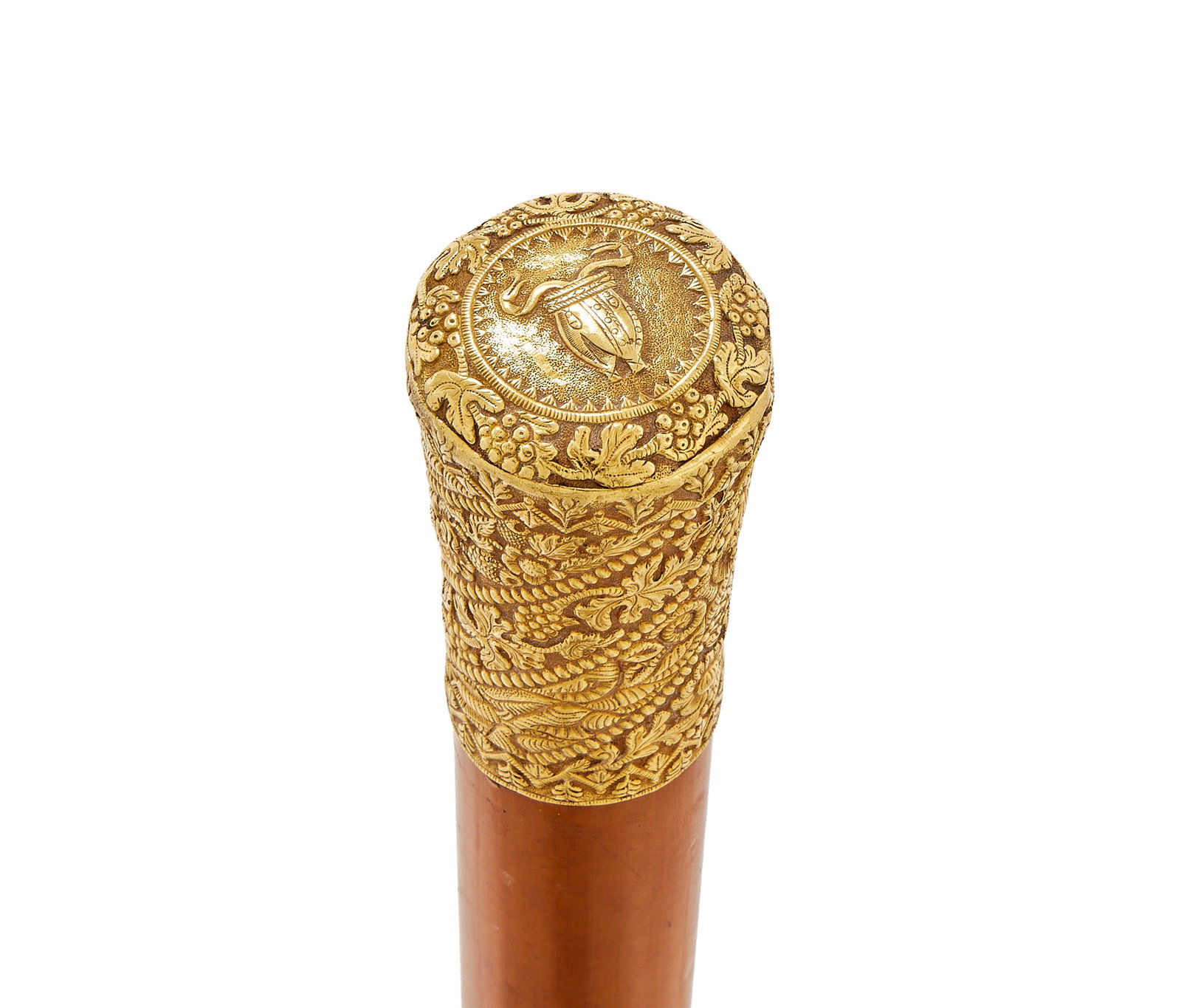 A GOLD MOUNTED WALKING STICK, UNMARKED: A GOLD MOUNTED WALKING STICKUNMARKEDThe Malacca cane with a chased foliate pommel101cm long