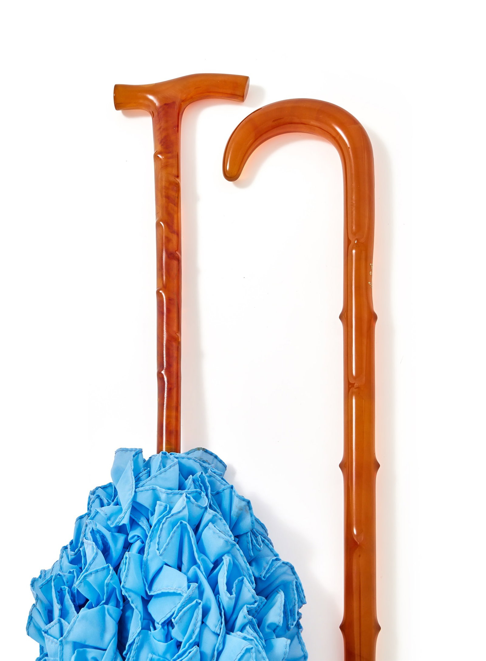 Y A CASED PRESSED TORTOISESHELL WALKING STICK AND A PARASOL: Y A CASED PRESSED TORTOISESHELL WALKING STICKInlaid with a Ducal Coronet95.5cm longIn a fitted presentation caseTogether with:A PRESSED TORTOISESHELL HANDLED PARASOL88cm long ϒ Indicates that thi
