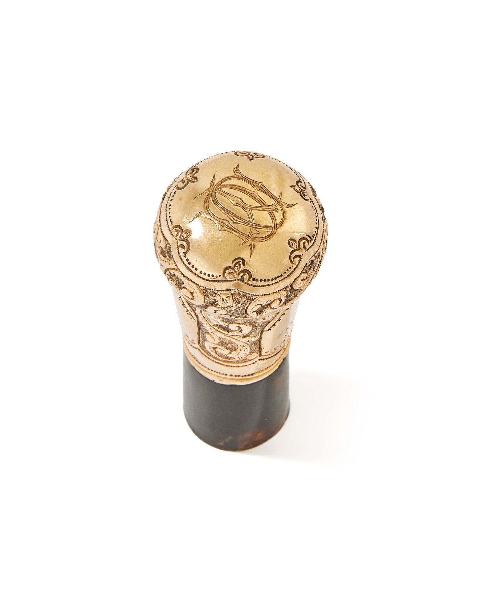 Y A GOLD MOUNTED AND TORTOISESHELL WALKING STICK, LATE 19TH CENTURY , UNMARKED: Y A GOLD MOUNTED AND TORTOISESHELL WALKING STICKLATE 19TH CENTURY, UNMARKEDThe tortoiseshell cane with a gold pommel, chased with foliate swags and engraved with a monogram89cm long ϒ Indicates t