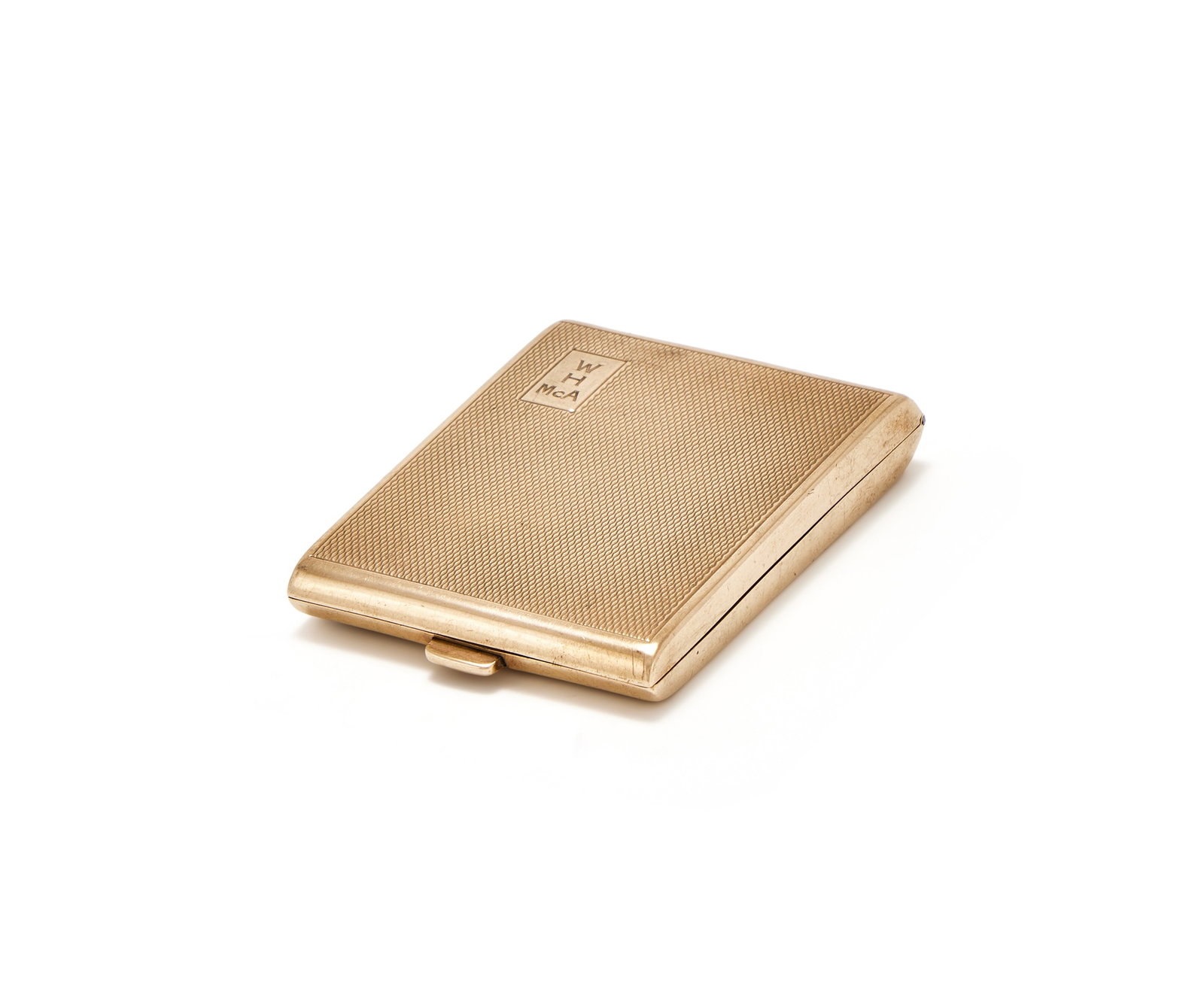A 9 CARAT GOLD VESTA CASE, WILLIAM NEALE & SON LTD., BIRMINGHAM 1929: A 9 CARAT GOLD VESTA CASEWILLIAM NEALE & SON LTD., BIRMINGHAM 1929With engine turned decoration and engraved W over H over McA within a rectangular reserve6.5cm long38gProvenance:From the Collection o