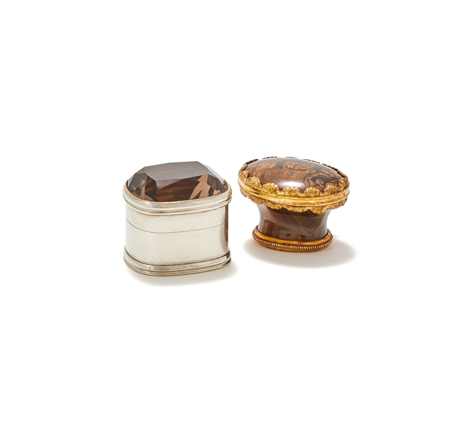 A GEORGE III SILVER OBLONG BOX AND A GILT MOUNTED AGATE BOX: A GEORGE III SILVER OBLONG BOXUNMARKEDThe lid inset with a cairngorm2.5cm longTogether with:A GILT MOUNTED AGATE BOX18TH CENTURY, UNMARKEDWith a hinged cover2.5cm long