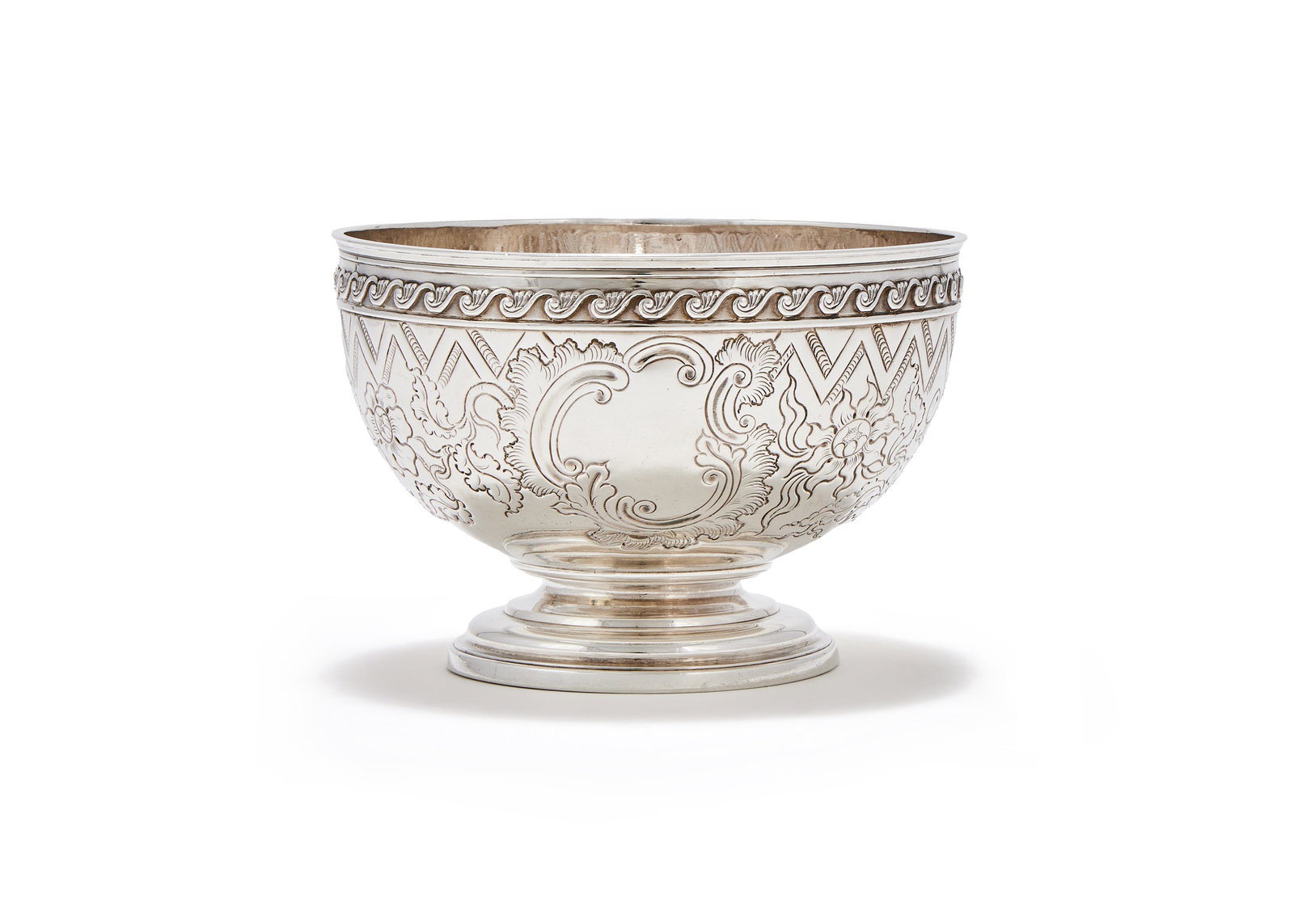 A GEORGE III SILVER PEDESTAL BOWL, RICHARD COOK, LONDON 1812: A GEORGE III SILVER PEDESTAL BOWLRICHARD COOK, LONDON 1812With a scroll border, chased with a band of flowers, a vacant cartouche and on a circular moulded spreading pedestal foot13cm diameter296g