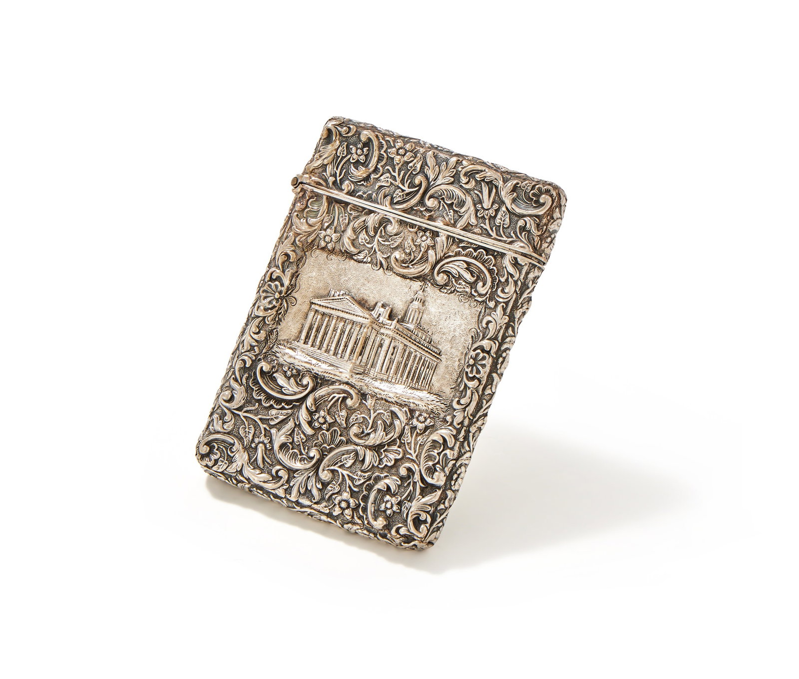 A VICTORIAN SILVER DOUBLE SIDE CASTLE TOP CARD CASE, JOSEPH WILMORE, LONDON 1842: A VICTORIAN SILVER DOUBLE SIDE CASTLE TOP CARD CASEJOSEPH WILMORE, LONDON 1842Chased with flowers, foliage and C-scrolls, the obverse with the Royal Exchange London, the reverse with Warwick