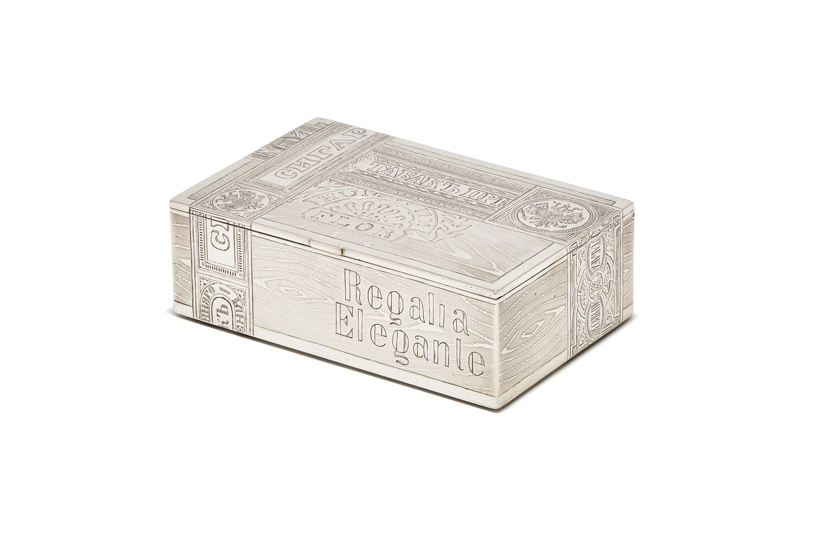 A RUSSIAN SILVER TROMPE L'OEIL CIGAR BOX, MAKER'S MARK MH (POSSIBLY MATVYEO NIKI FOROV), MOSCOW 1884: A RUSSIAN SILVER TROMPE L'OEIL CIGAR BOXMAKER'S MARK MH (POSSIBLY MATVYEO NIKI FOROV), MOSCOW 1884, LATER SOVIET MARK, POST 1920 POLISH MARKEngraved to simulate a cigar box with wood grain, label of c