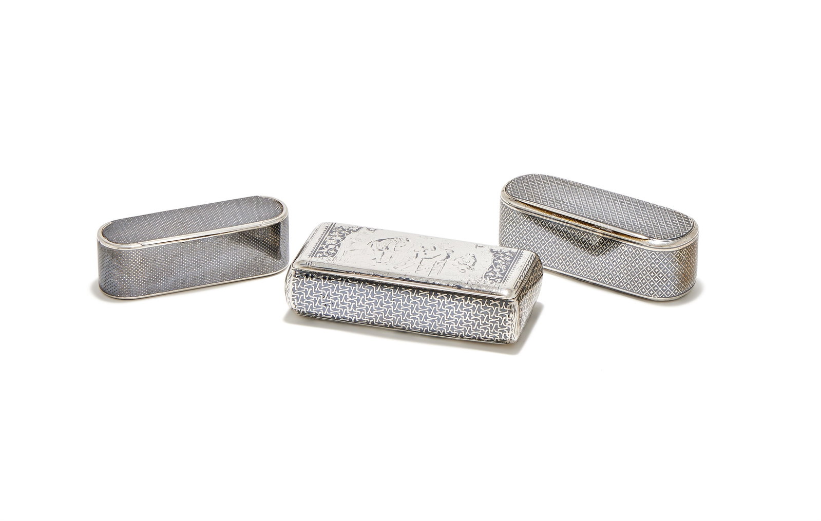 A RUSSIAN SILVER AND NIELLO BOX, MAKER'S MARK CYRILLIC FV, MOSCOW 1856: A RUSSIAN SILVER AND NIELLO BOXMAKER'S MARK CYRILLIC FV, MOSCOW 1856With chequered decoration8.5cm longTogether with:A FRENCH SILVER AND NIELLO BOXPOST 1838 MARKSWith cross decoration9cm longA FRENCH 