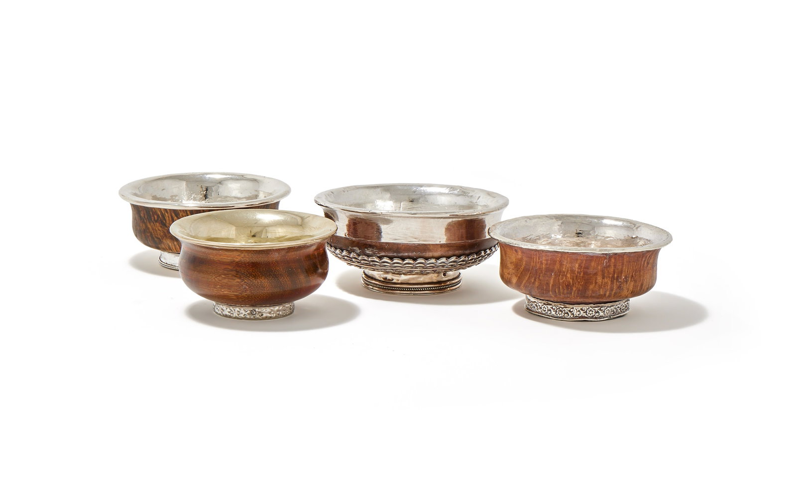 FOUR, TIBETAN SILVER MOUNTED AND LINED TEA BOWLS (1 of 1)
