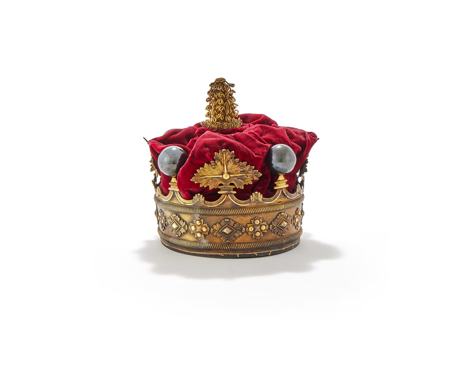 A GILT CORONET OF A MARQUESS OF THE UNITED KINGDOM, UNMARKED, LATE 19TH CENTURY: A GILT CORONET OF A MARQUESS OF THE UNITED KINGDOMUNMARKED, LATE 19TH CENTURYChased with four strawberry leaves and four silvered balls as 'pearls', red velvet cap with gold braid bullion and a cream 