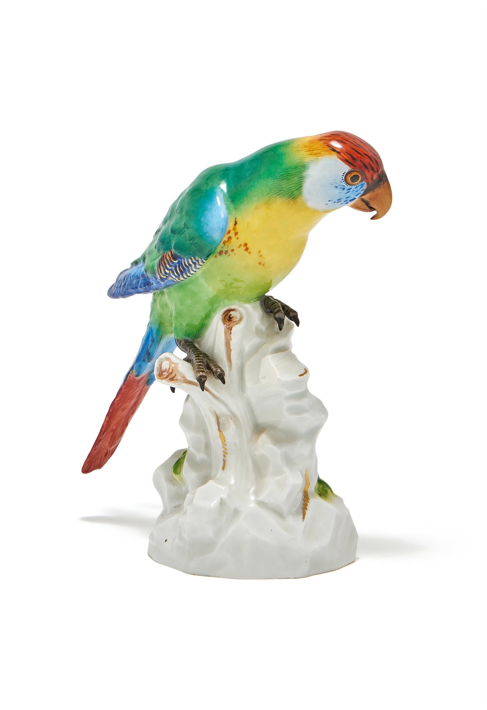 A MEISSEN MODEL OF A PARROT, BLUE CROSSED SWORDS MARKS, LATE 19TH CENTURY: A MEISSEN MODEL OF A PARROTBLUE CROSSED SWORDS MARKS, LATE 19TH CENTURYModelled perched on a stump21cm high