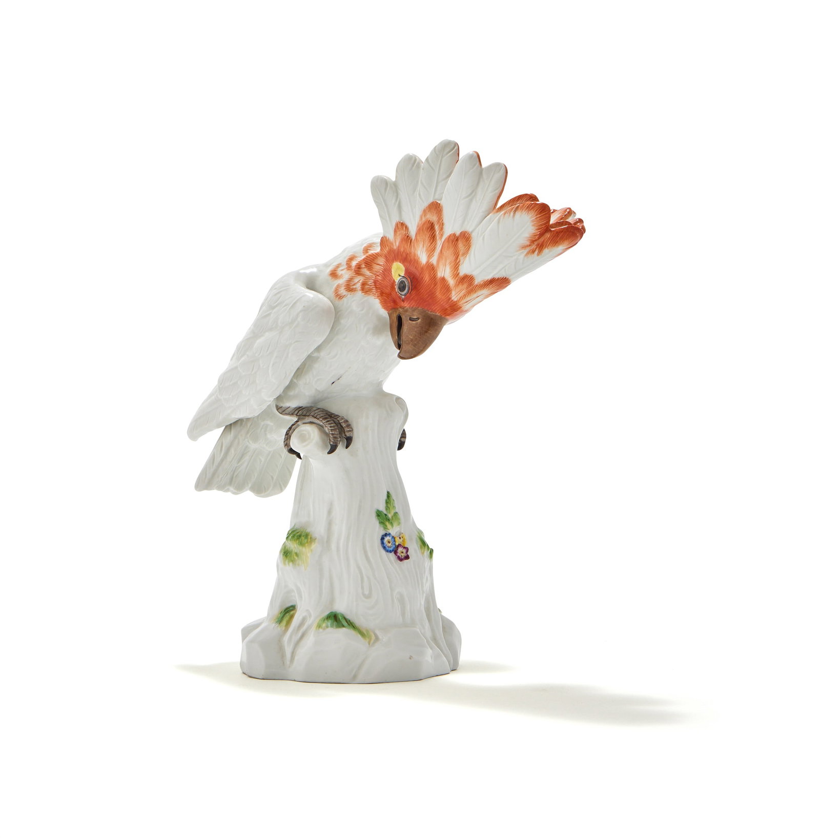 MEISSEN, A MODEL OF A COCKATOO PERCHED ON A STUMP, BLUE CROSSED SWORDS MARKS, 20TH CENTURY: MEISSEN, A MODEL OF A COCKATOO PERCHED ON A STUMPBLUE CROSSED SWORDS MARKS, 20TH CENTURYIncised 57a24.5cm high