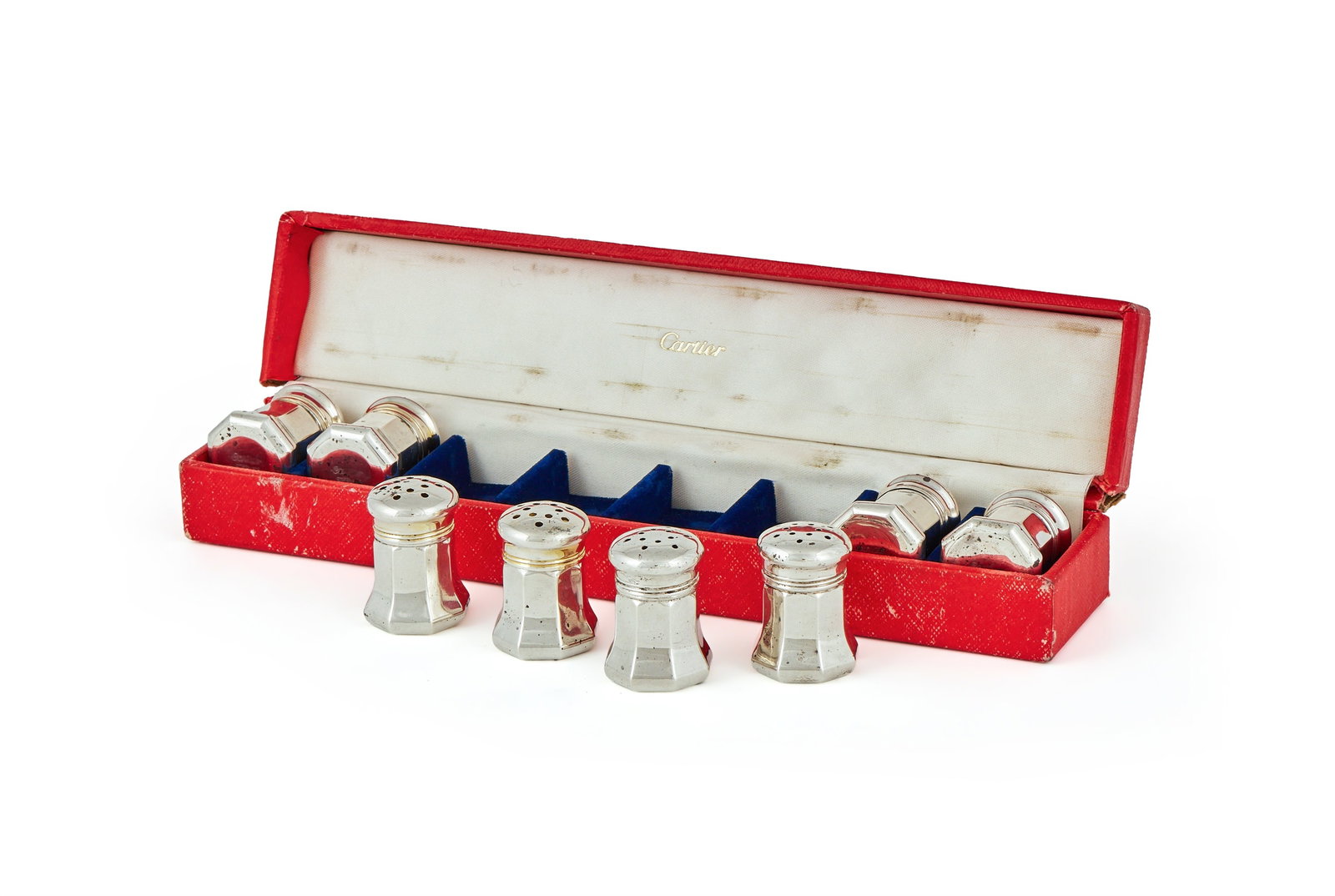 CARTIER, A CASED SET OF EIGHT AMERICAN SILVER AND SILVER GILT SALT AND PEPPER SHAKERS: CARTIER, A CASED SET OF EIGHT AMERICAN SILVER AND SILVER GILT SALT AND PEPPER SHAKERSSTAMPED STERLINGWith pierced domed covers and flared bodies4cm high51g (1.65 oz)