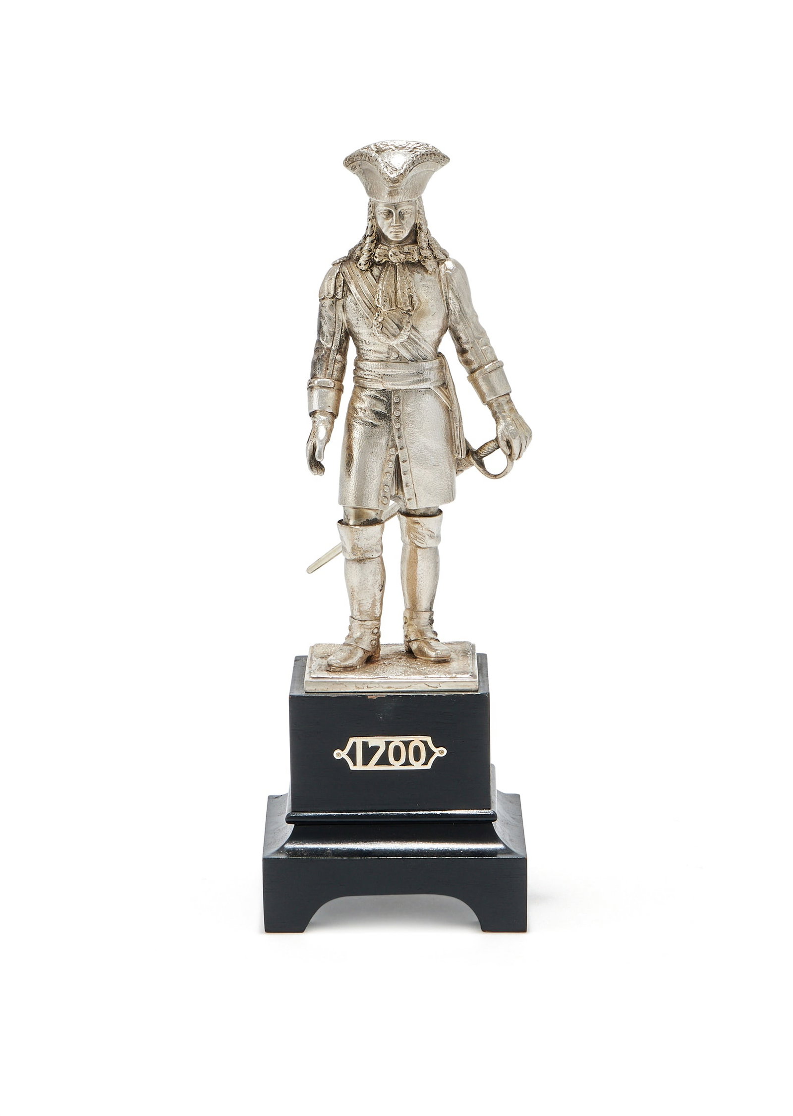 A SILVER FIGURE OF A LIFE GUARD, CARRINGTON & CO., LONDON 1907: A SILVER FIGURE OF A LIFE GUARDCARRINGTON & CO., LONDON 1907The Queen Anne Period officer in full dress circa 1700, on a black wood plinth applied with 170026cm high including the plinthProvenance:A P