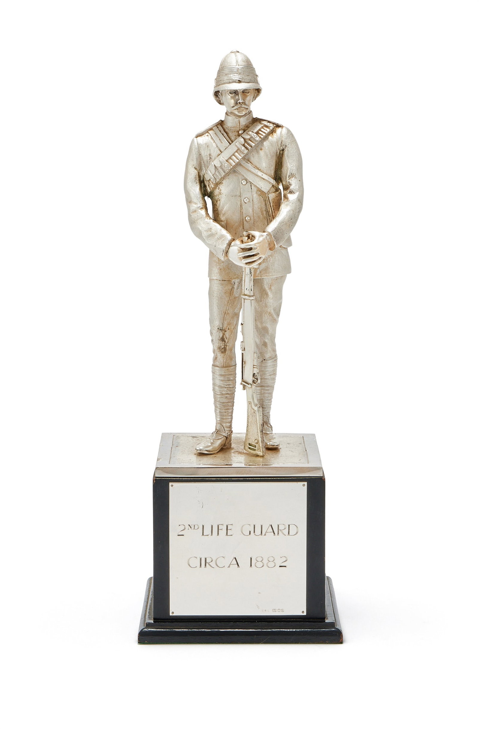A SILVER FIGURE OF A LIFE GUARD TROOPER, WILLIAM COMYNS & SONS LTD., LONDON 1991: A SILVER FIGURE OF A LIFE GUARD TROOPERWILLIAM COMYNS & SONS LTD., LONDON 1991In late Victorian tropical dress with pith helmet, on a plinth with plaque inscribed '2nd Life Guard Circa 1882'38cm high 